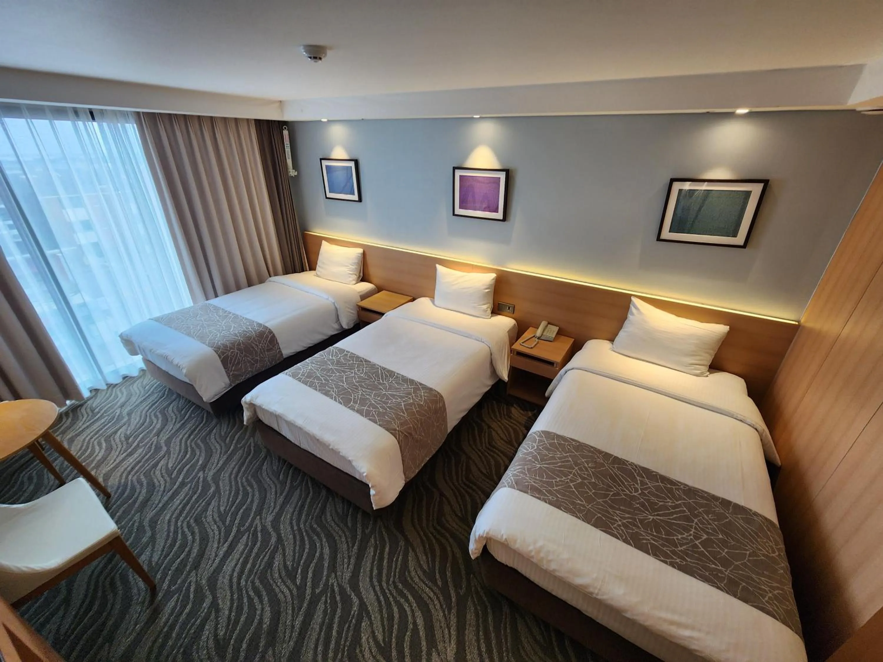 Bed in Seogwipo JS Hotel