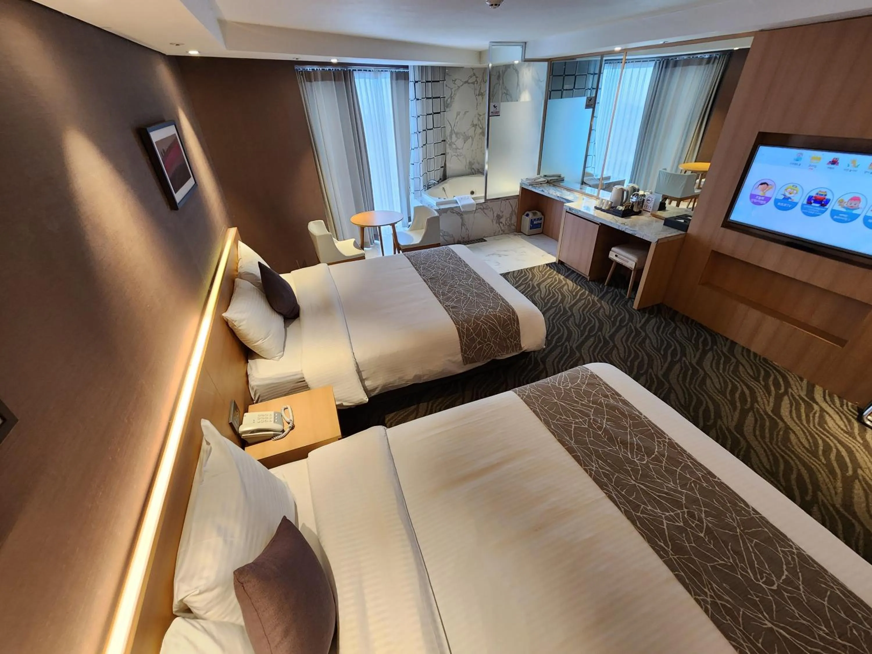 Bed in Seogwipo JS Hotel