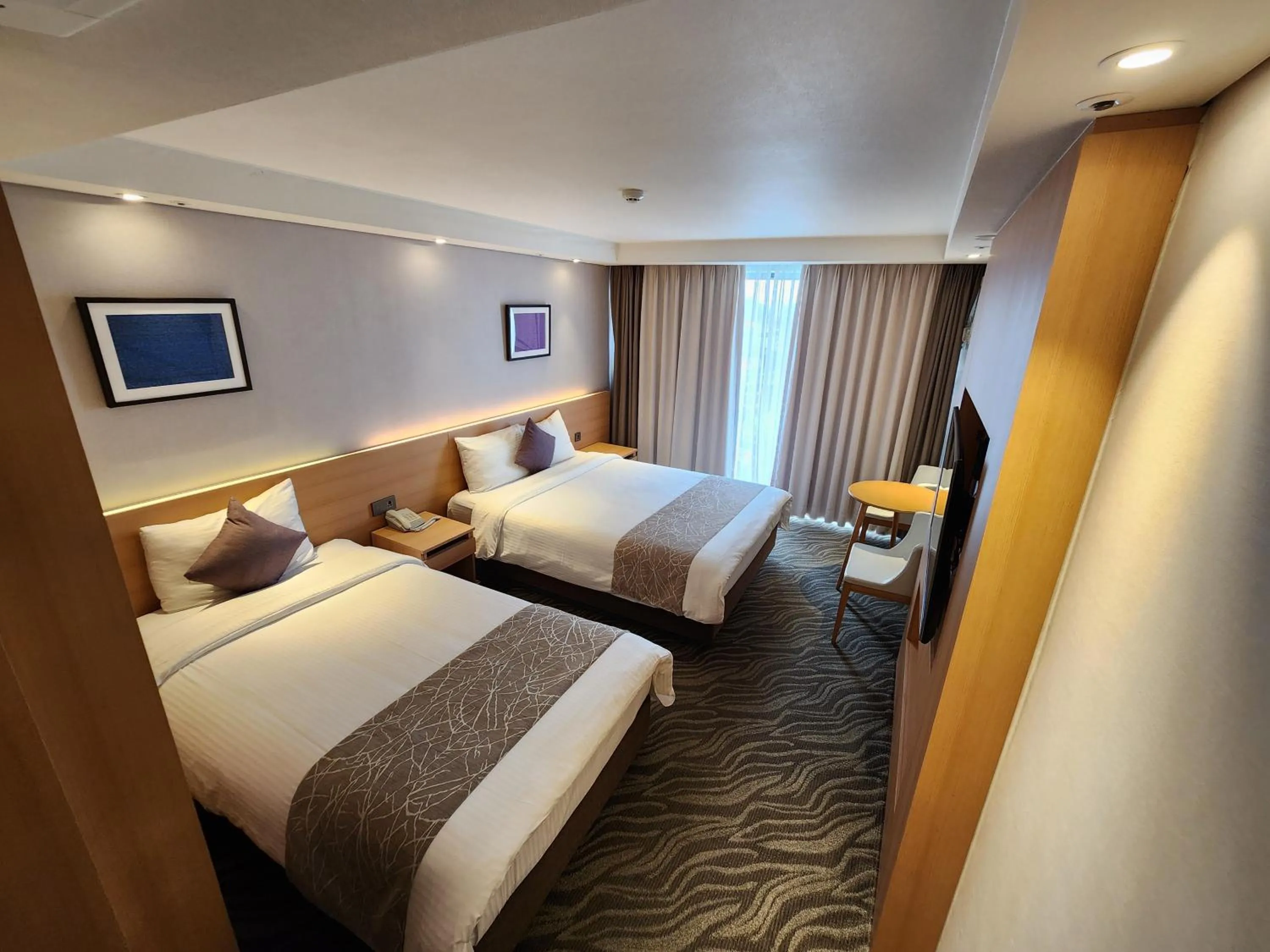 Bed in Seogwipo JS Hotel