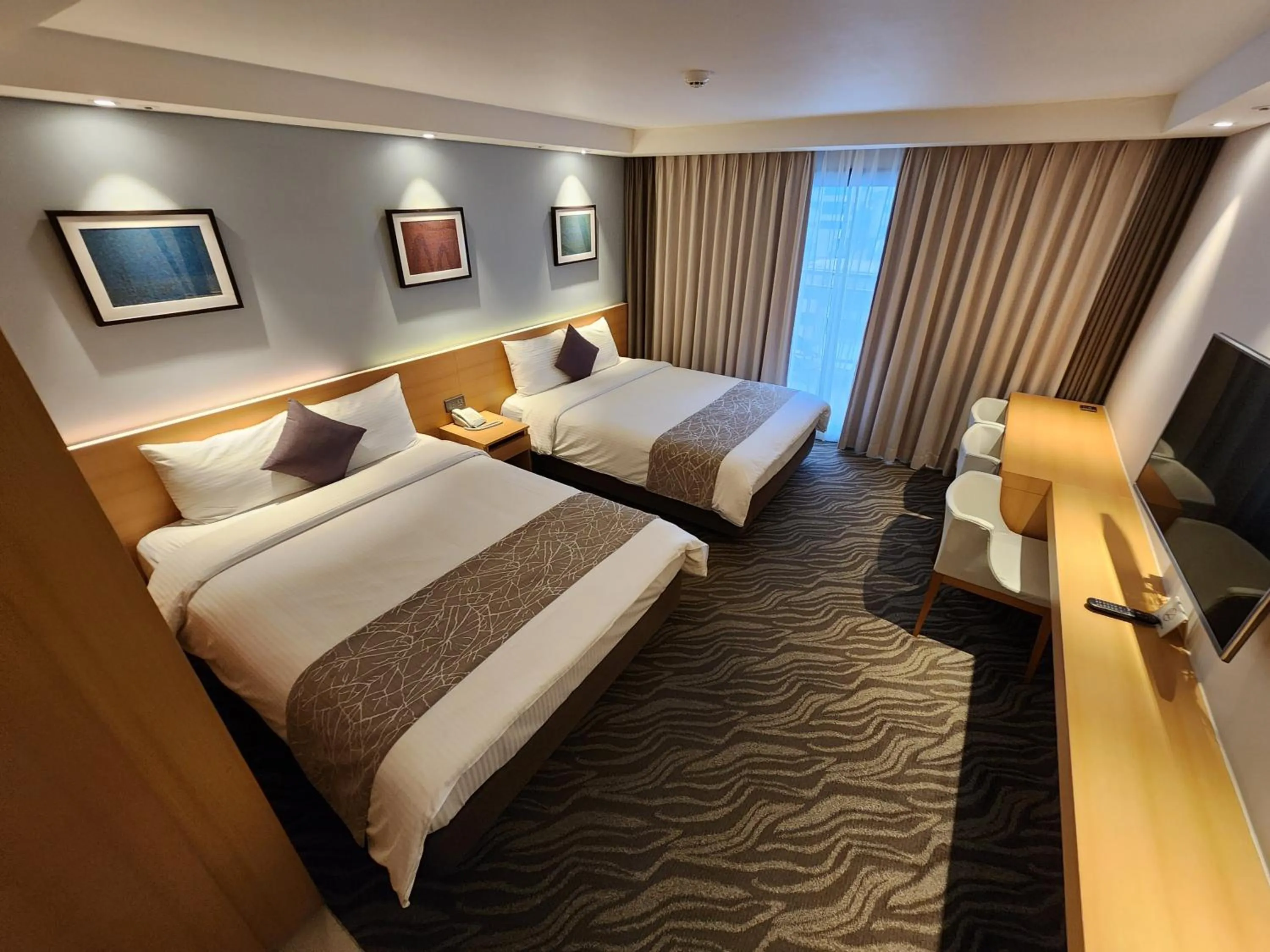 Bed in Seogwipo JS Hotel