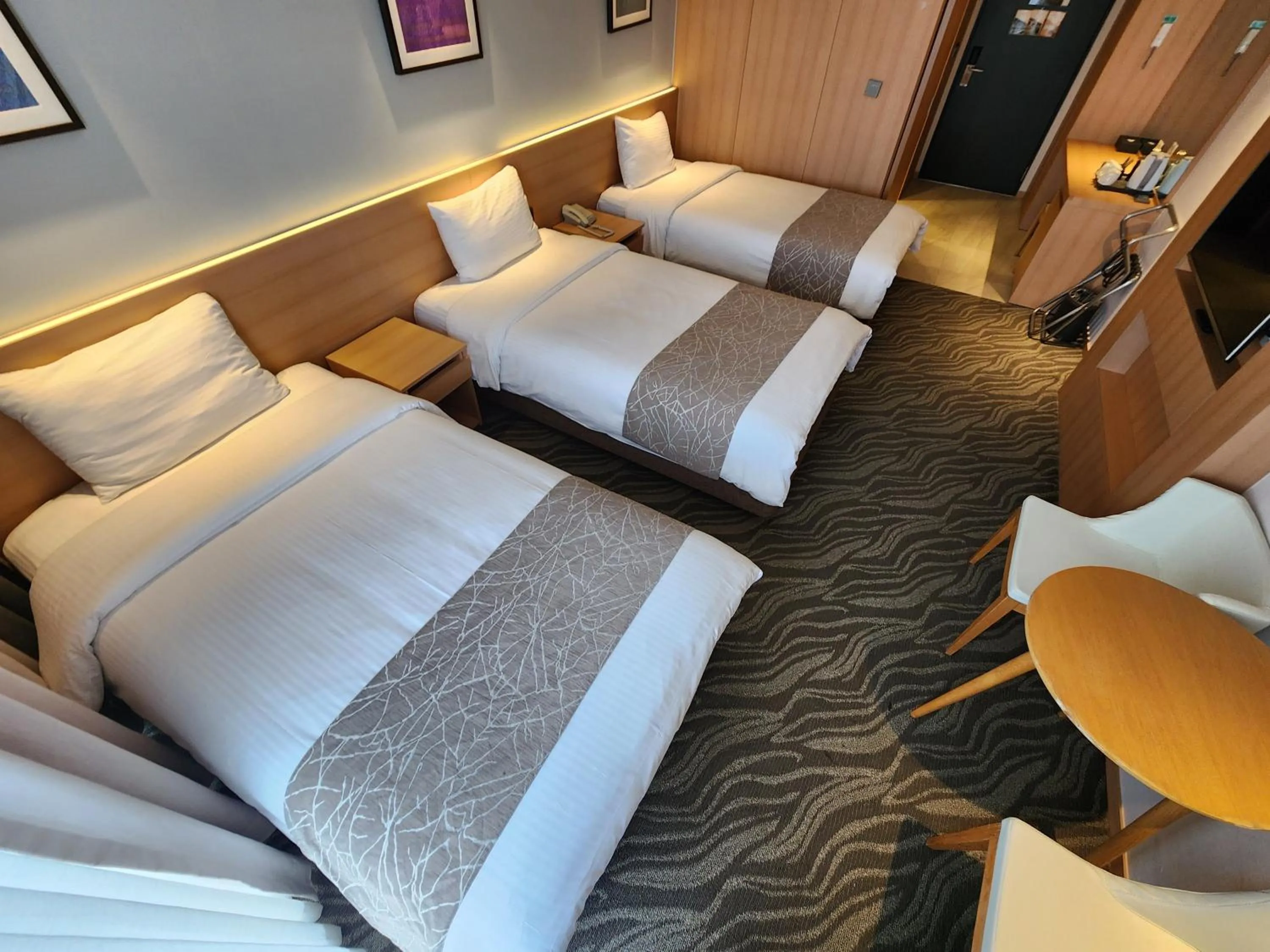 Bed in Seogwipo JS Hotel