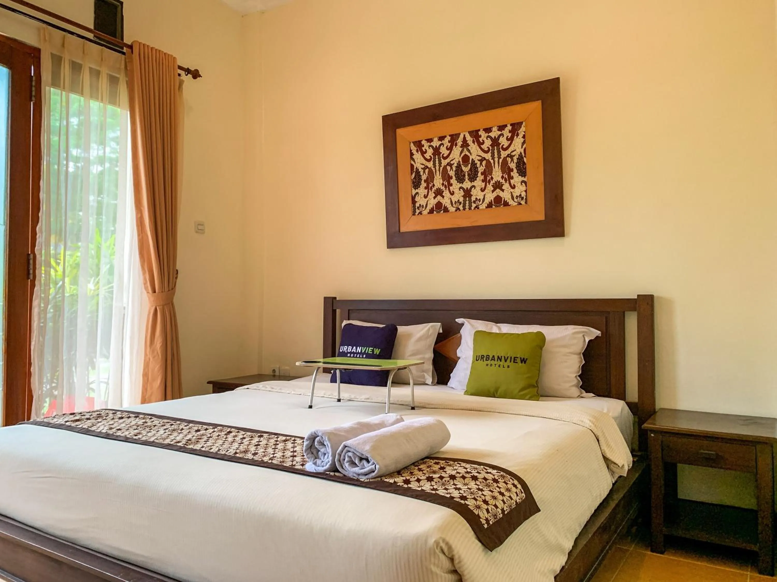 Bed in Urbanview Sasono Putro Condoongcatur by RedDoorz