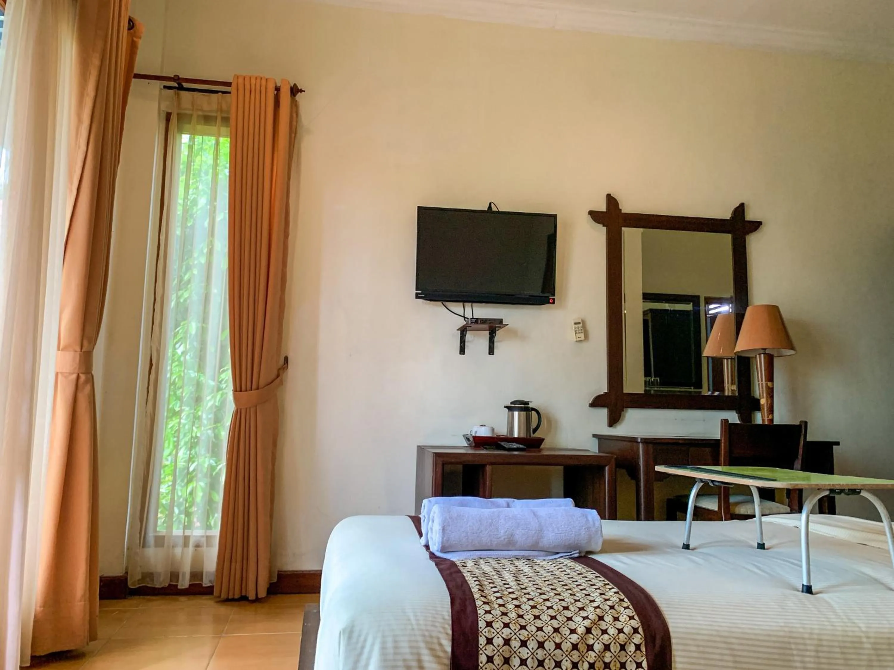 Bed in Urbanview Sasono Putro Condoongcatur by RedDoorz