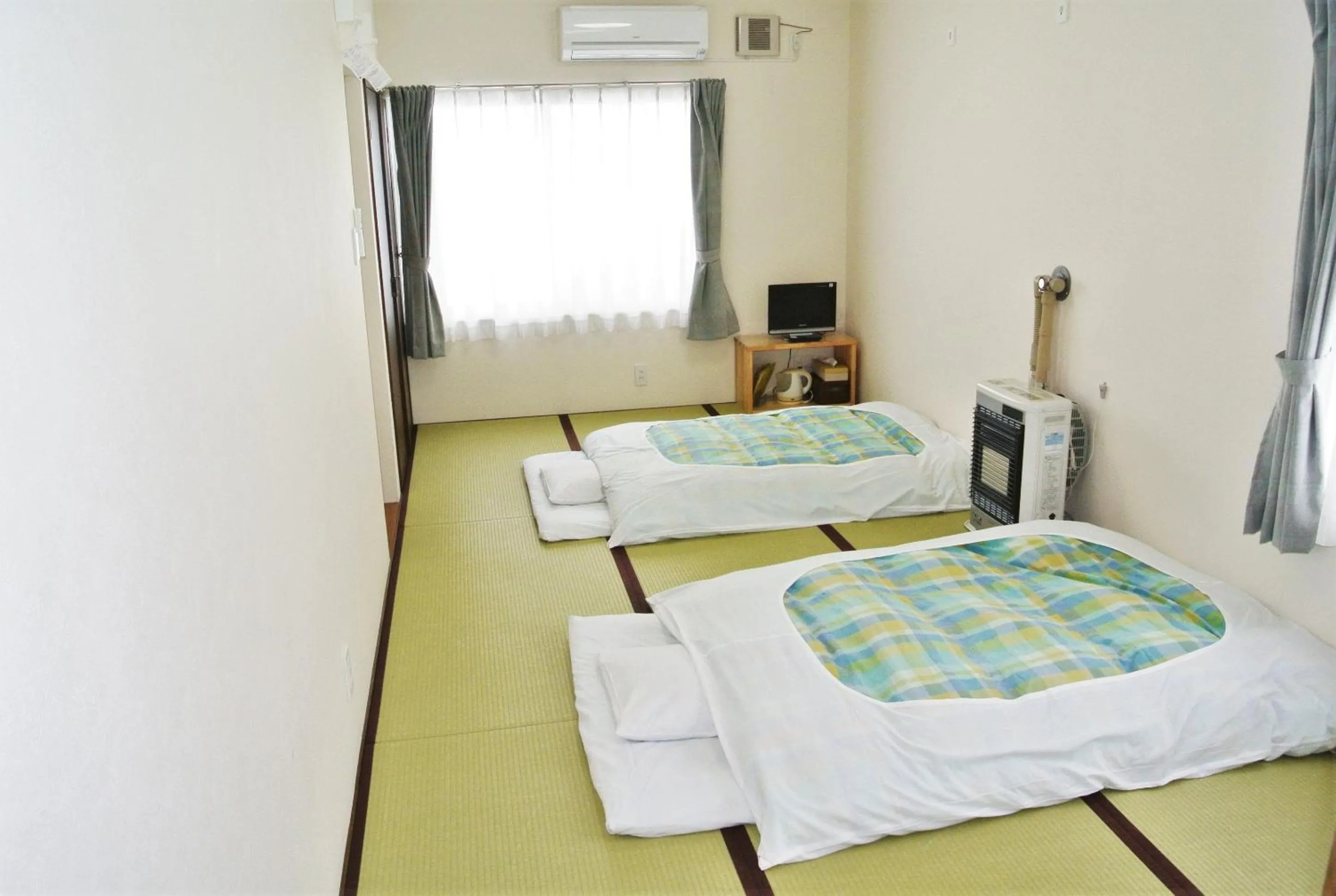 Bed in Pension Megumiyuki