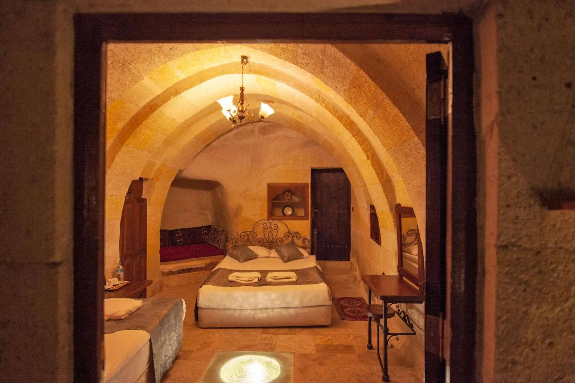 Photo of the whole room, Bed in Center Cave House