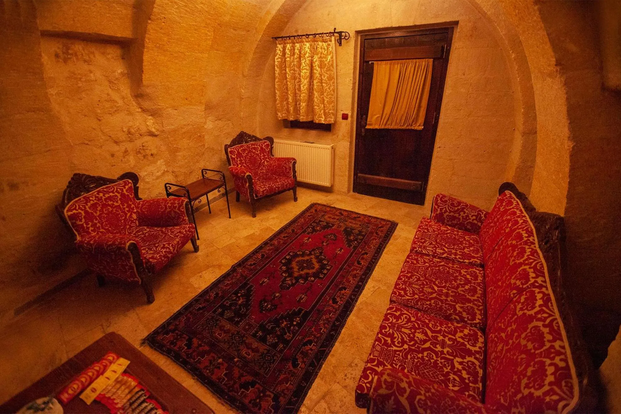 Seating area, Bed in Center Cave House