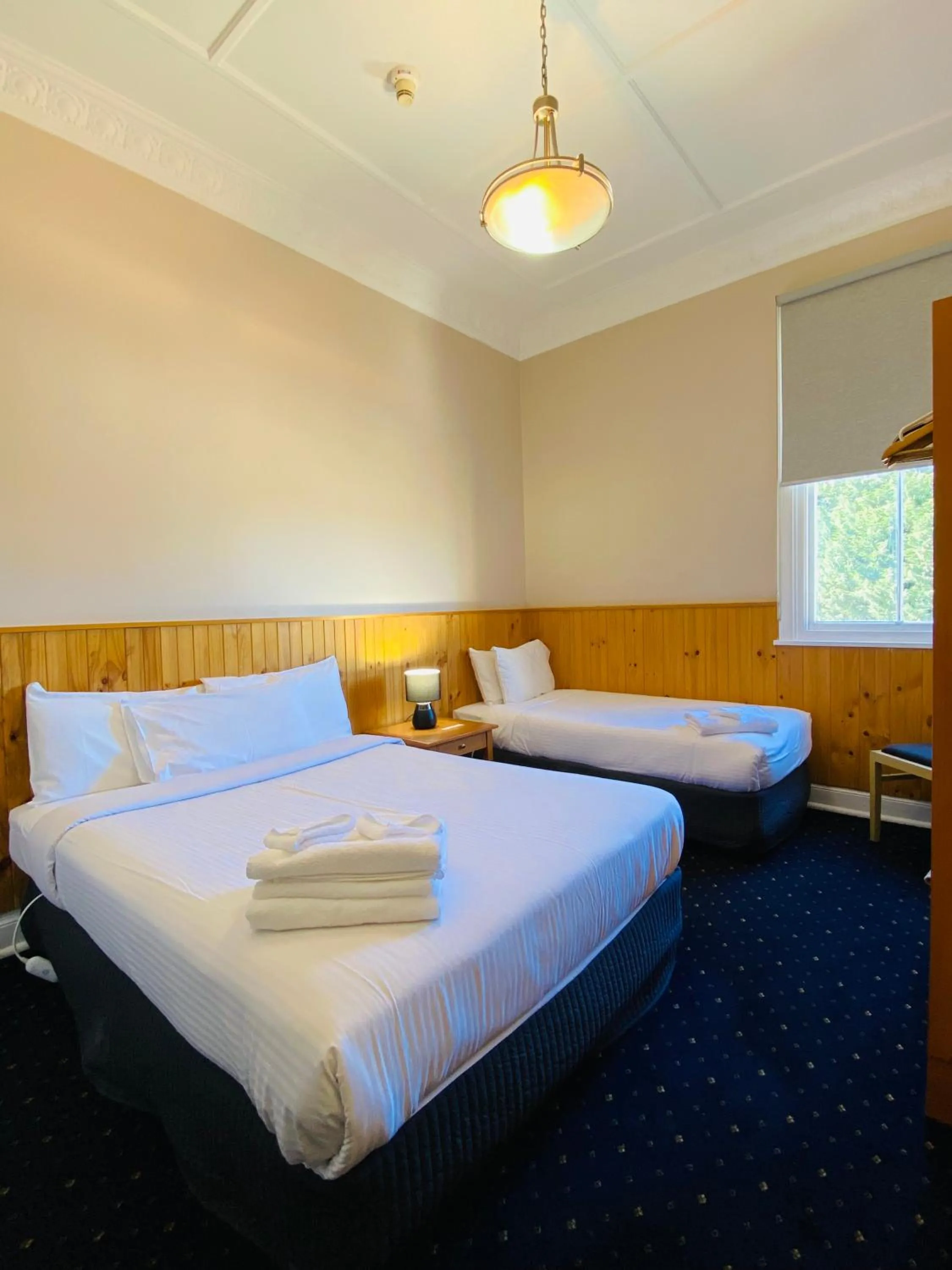 Bed in Gardners Inn Hotel