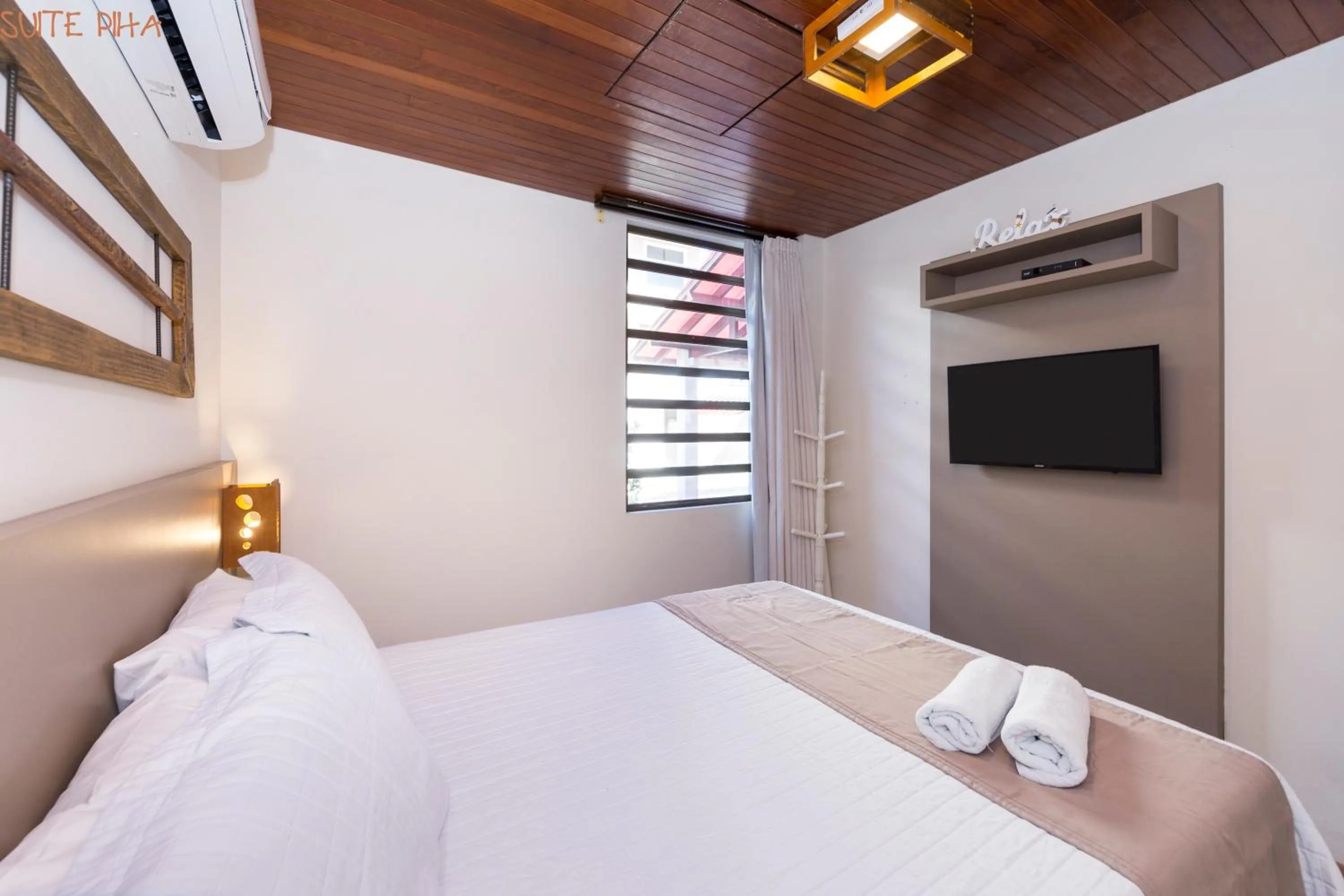 View (from property/room), Bed in Pousada Kia Ora Bombinhas