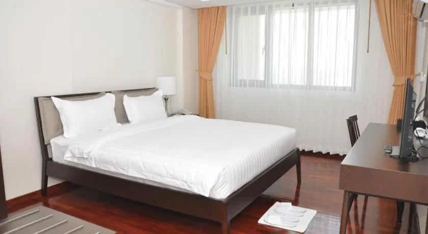 Bed in Myanmar Life Hotel