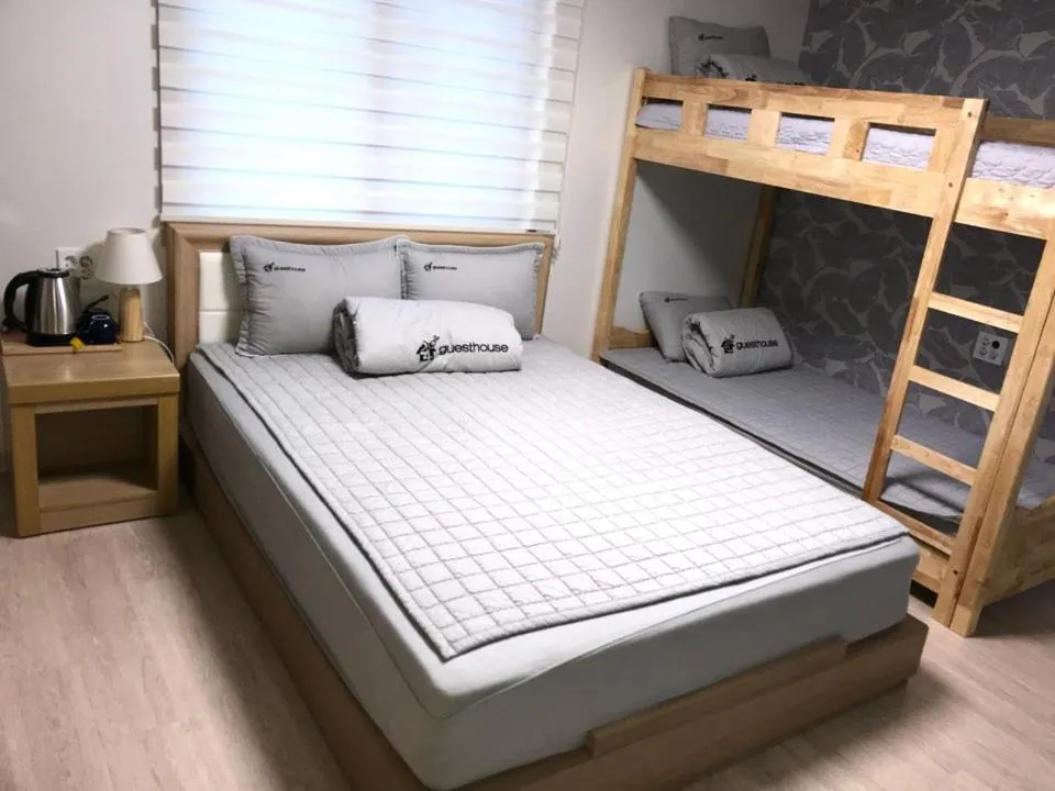 Bed in 24 Guesthouse Suncheon