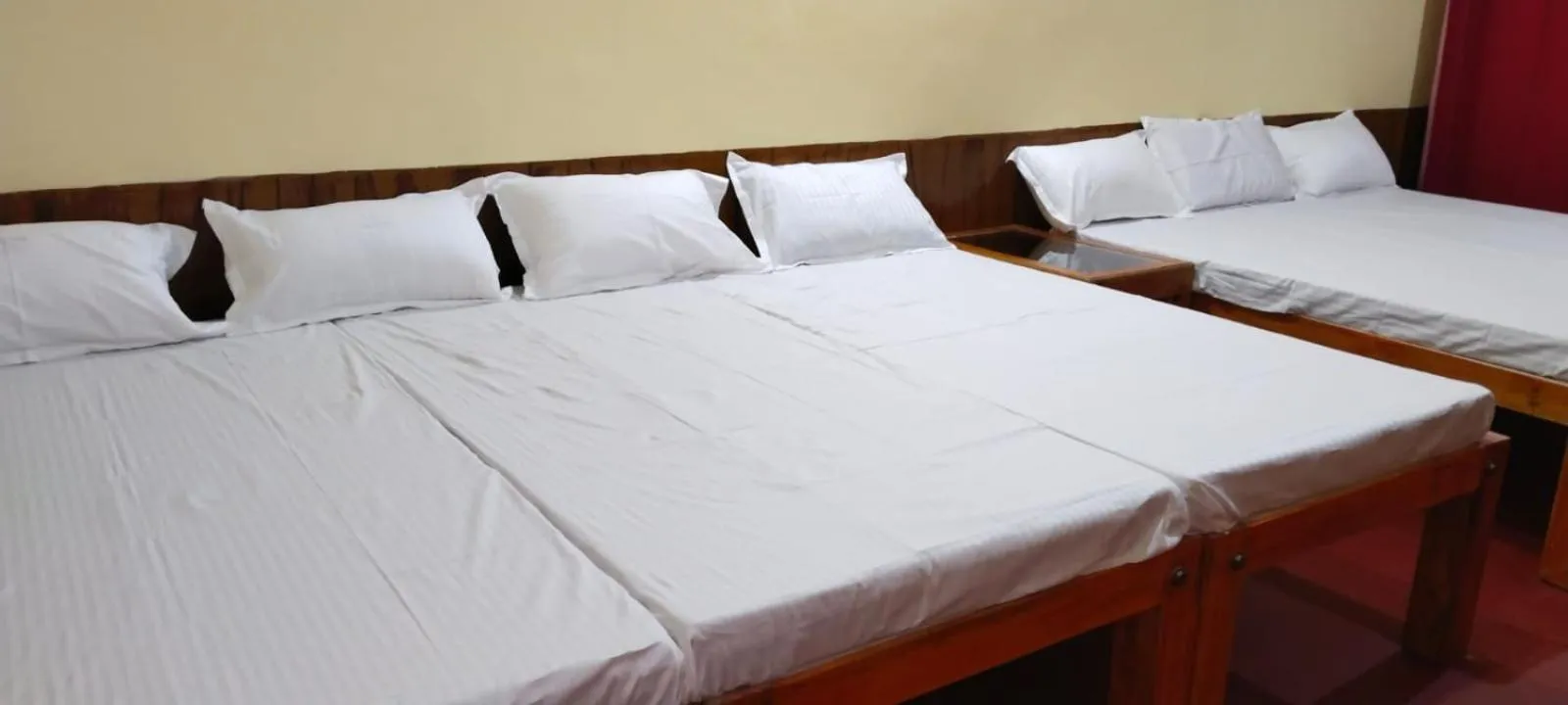 Bed in Satya Anand Cottage Pure Veg and Non Alcoholic Hotel