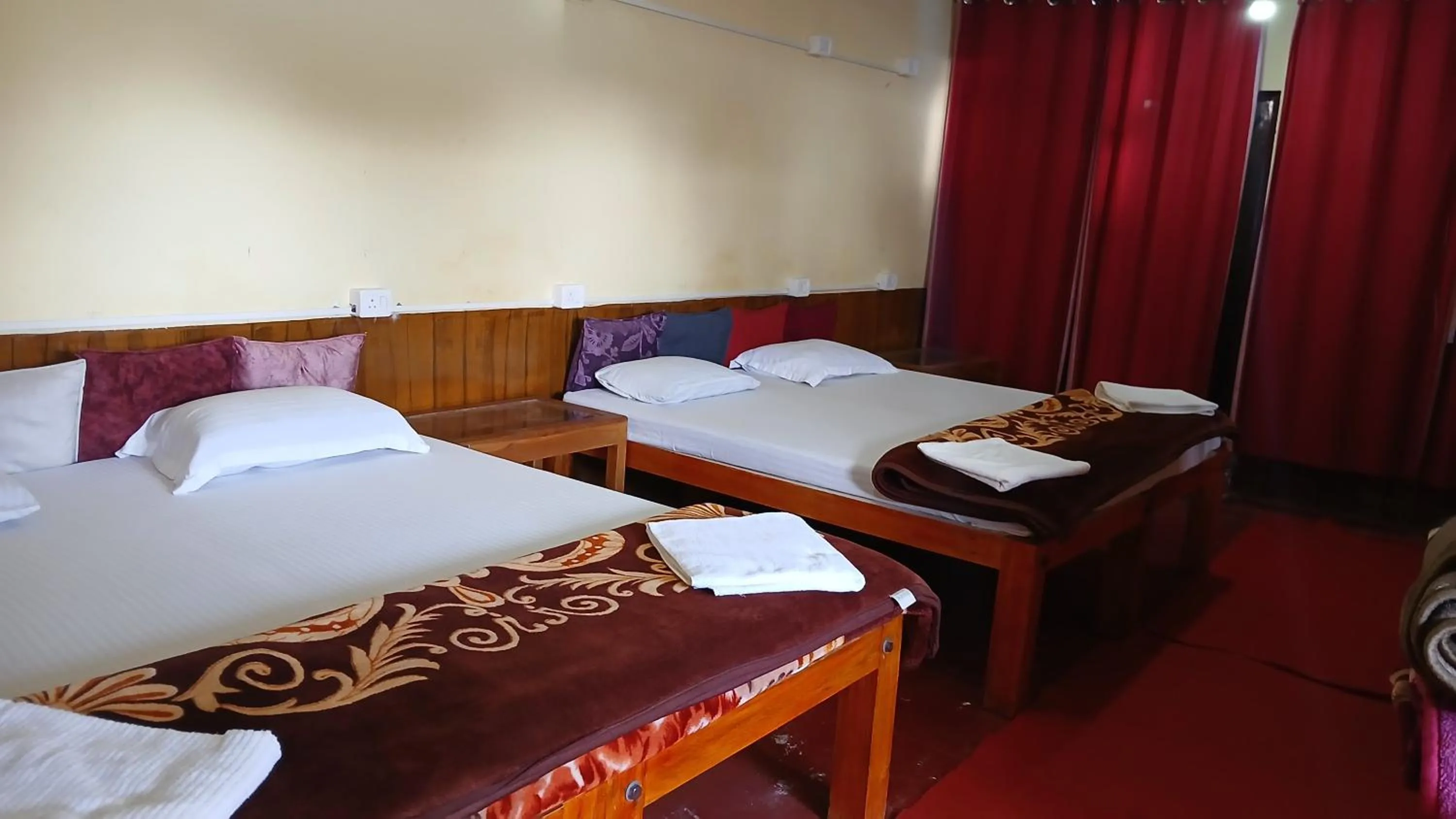 Photo of the whole room, Bed in Satya Anand Cottage Pure Veg and Non Alcoholic Hotel