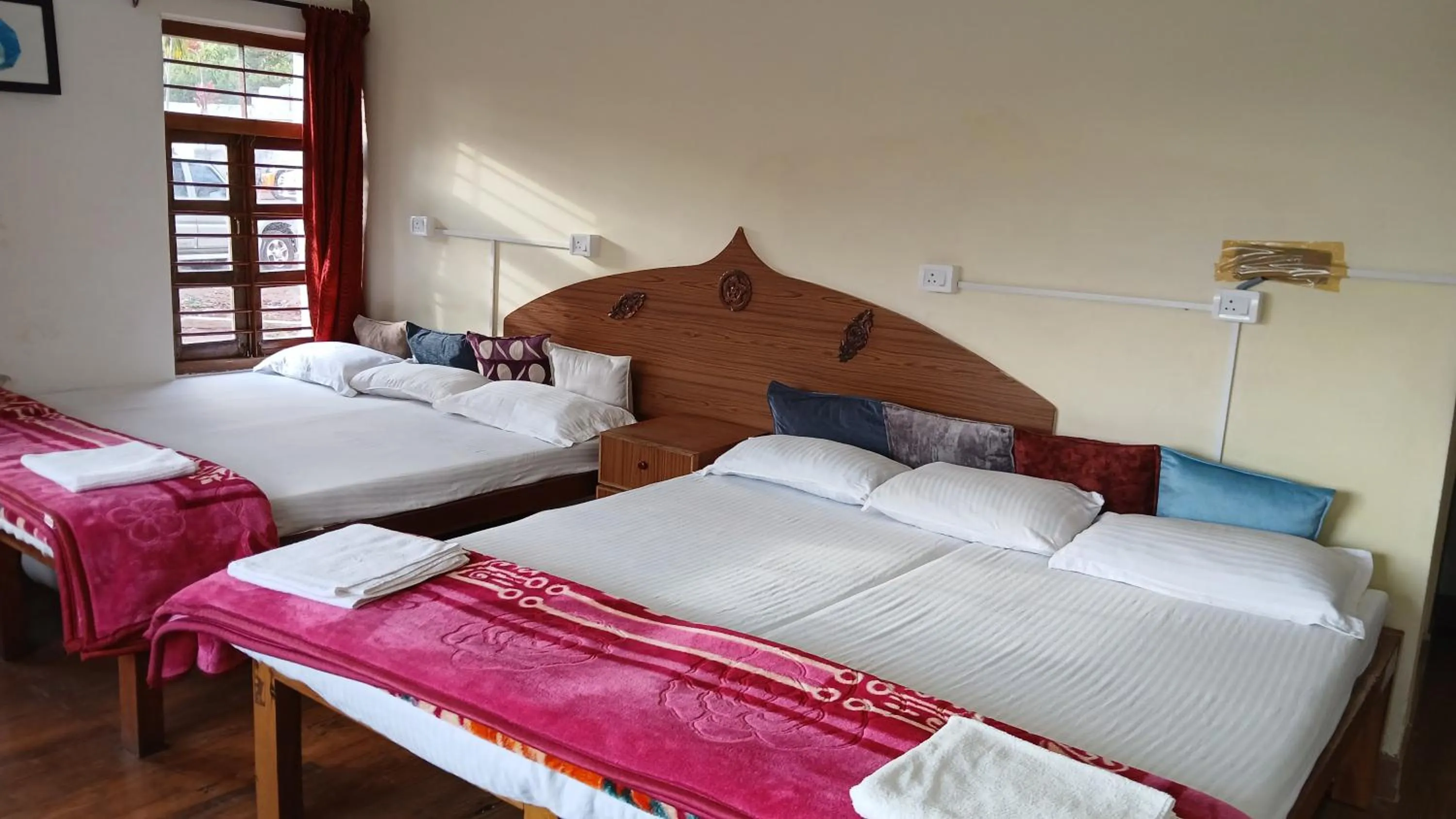 Bed in Satya Anand Cottage Pure Veg and Non Alcoholic Hotel