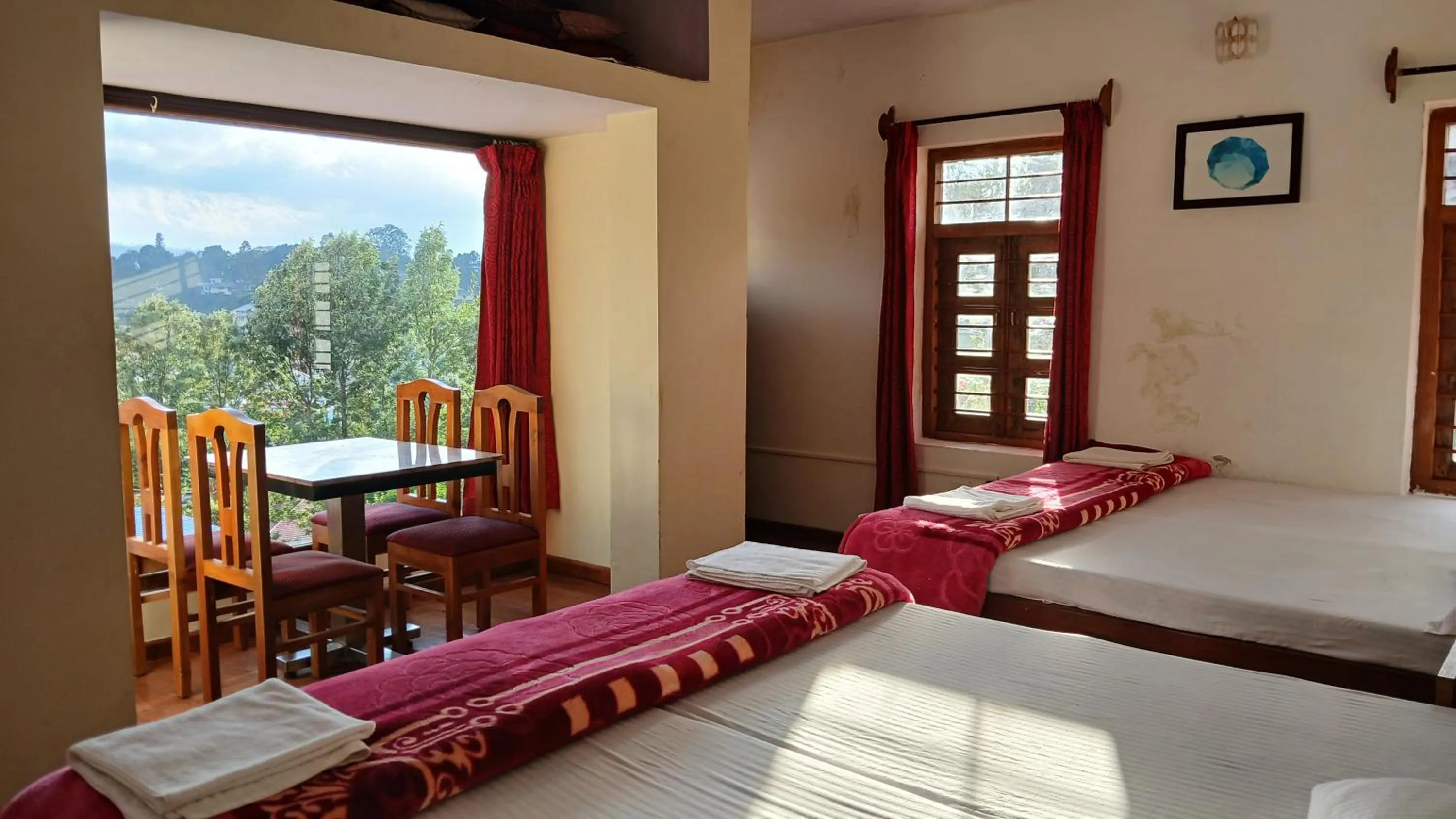 Bed in Satya Anand Cottage Pure Veg and Non Alcoholic Hotel
