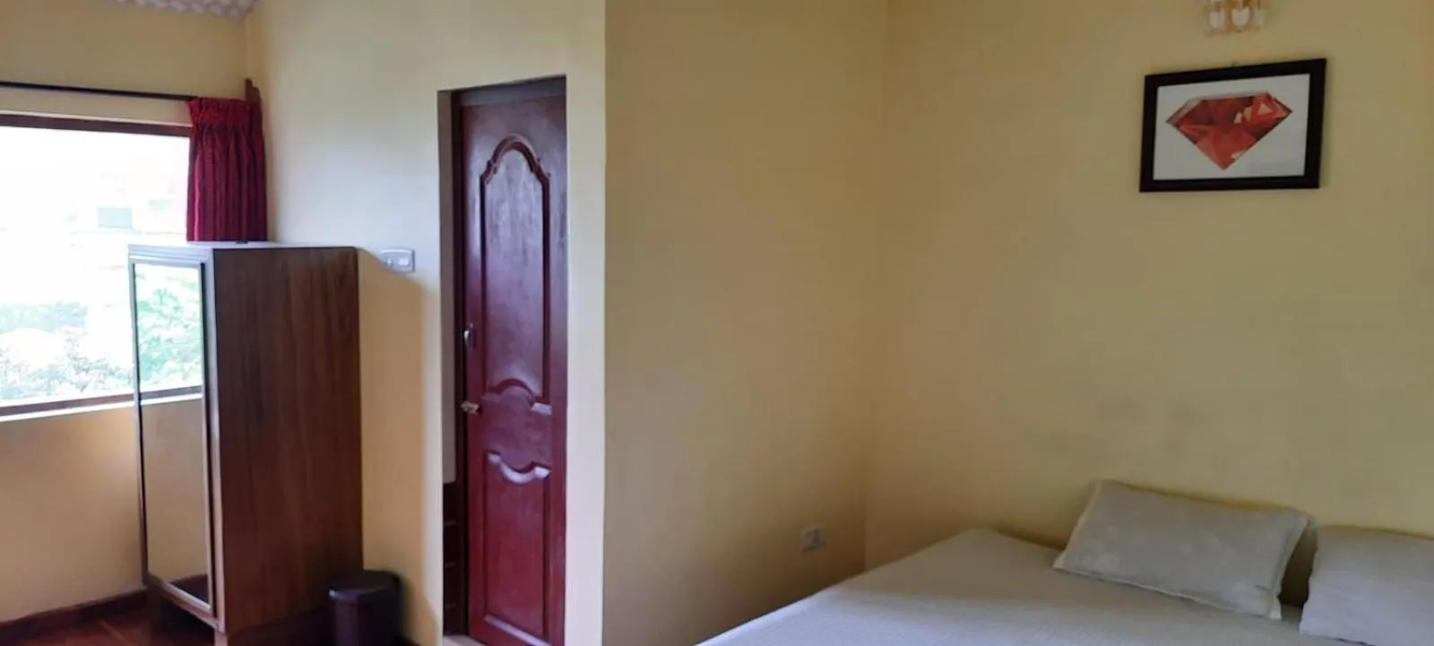 Bed in Satya Anand Cottage Pure Veg and Non Alcoholic Hotel