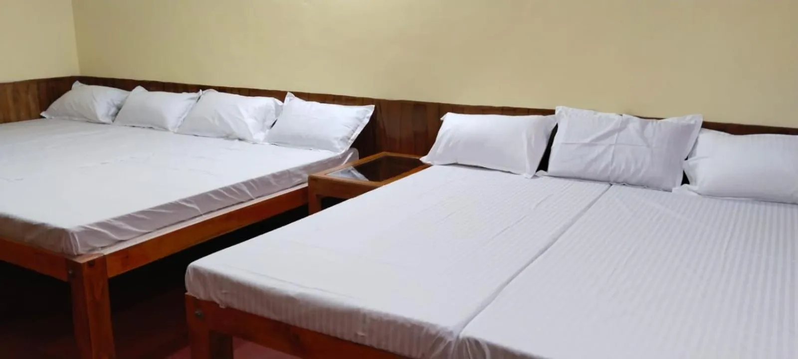Bed in Satya Anand Cottage Pure Veg and Non Alcoholic Hotel