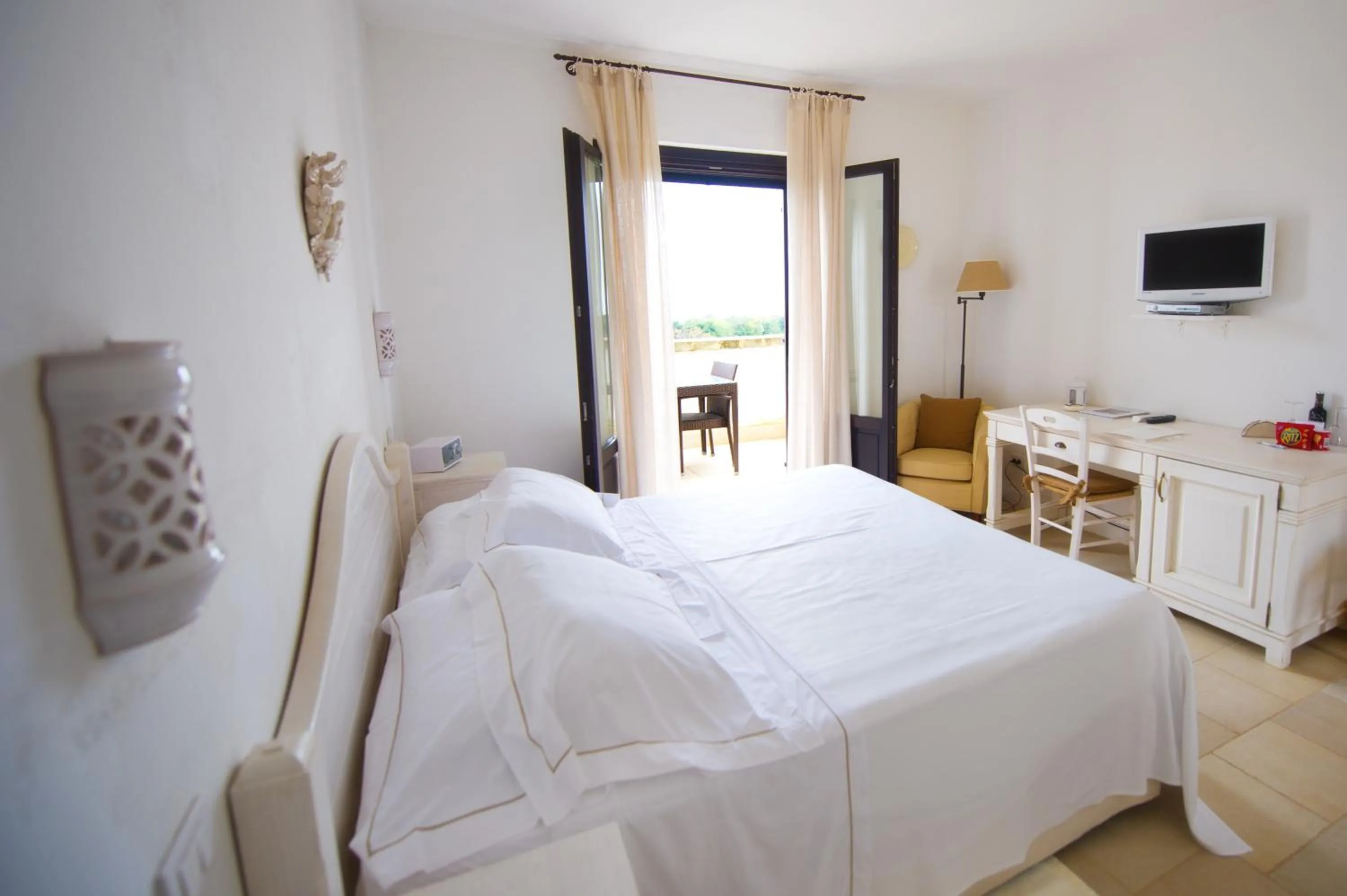 Photo of the whole room, Bed in Borgobianco Resort & Spa Polignano - MGallery Collection