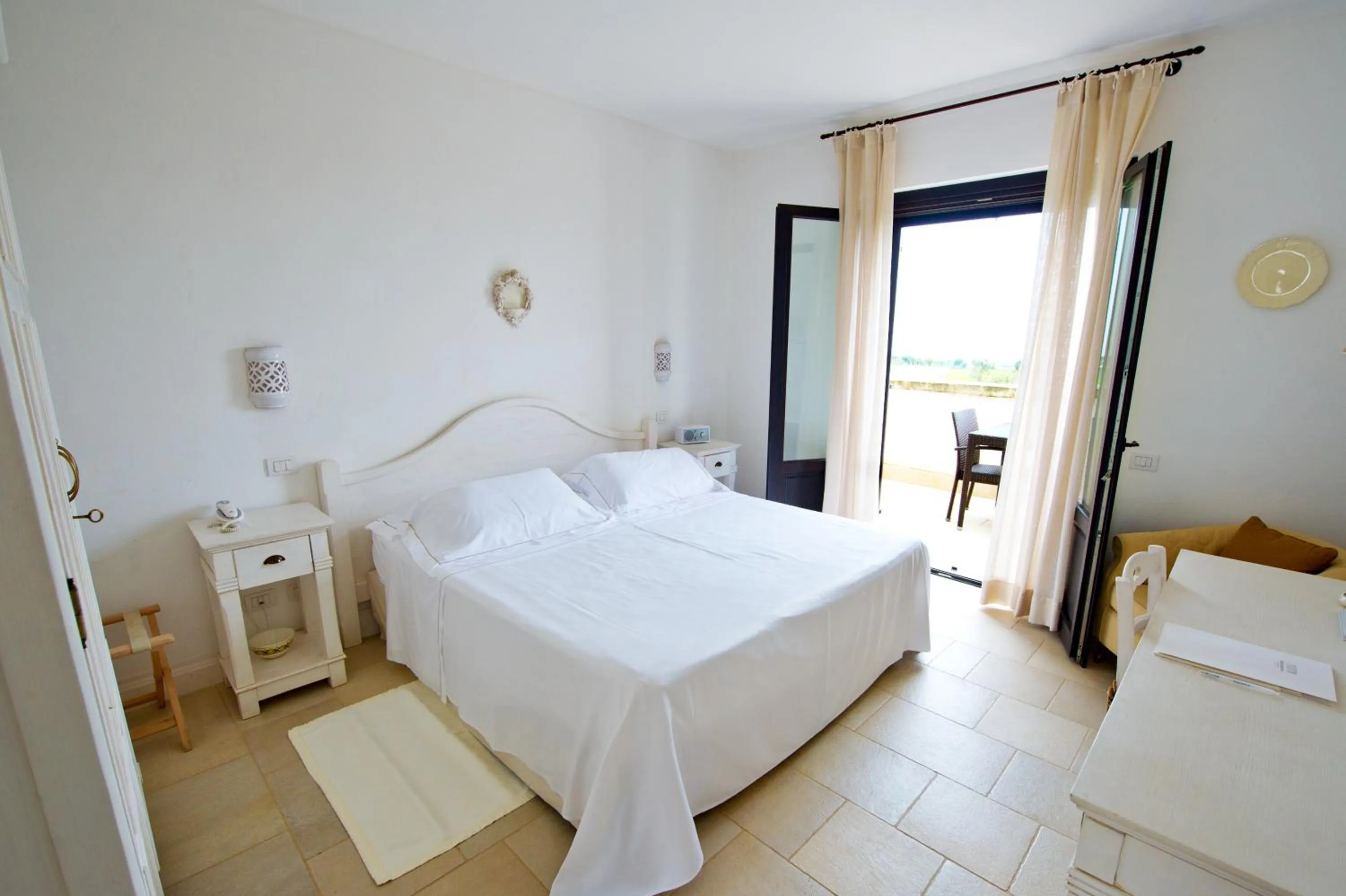 Photo of the whole room, Bed in Borgobianco Resort & Spa Polignano - MGallery Collection