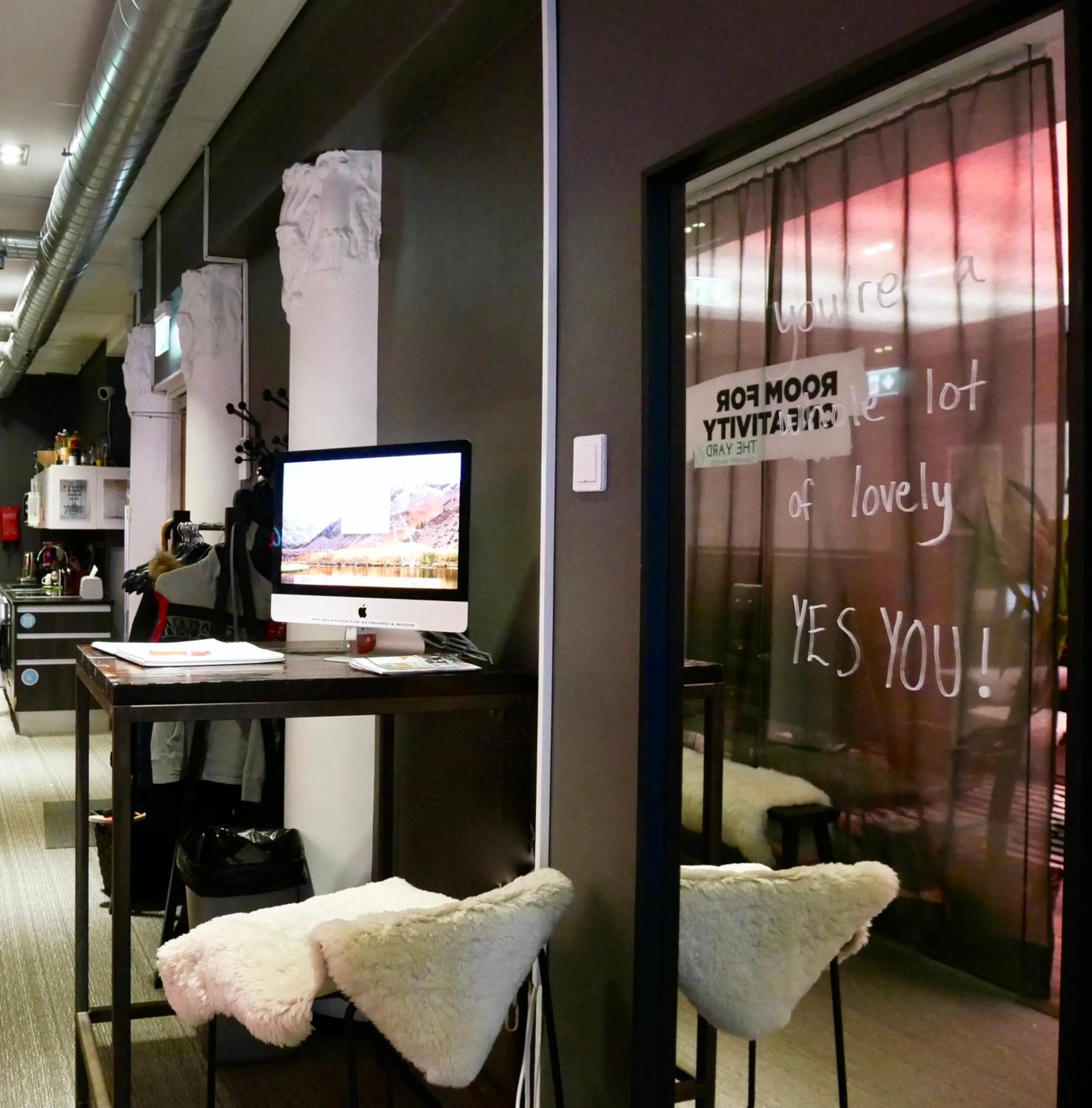 Communal lounge/ TV room in The Yard Hostel