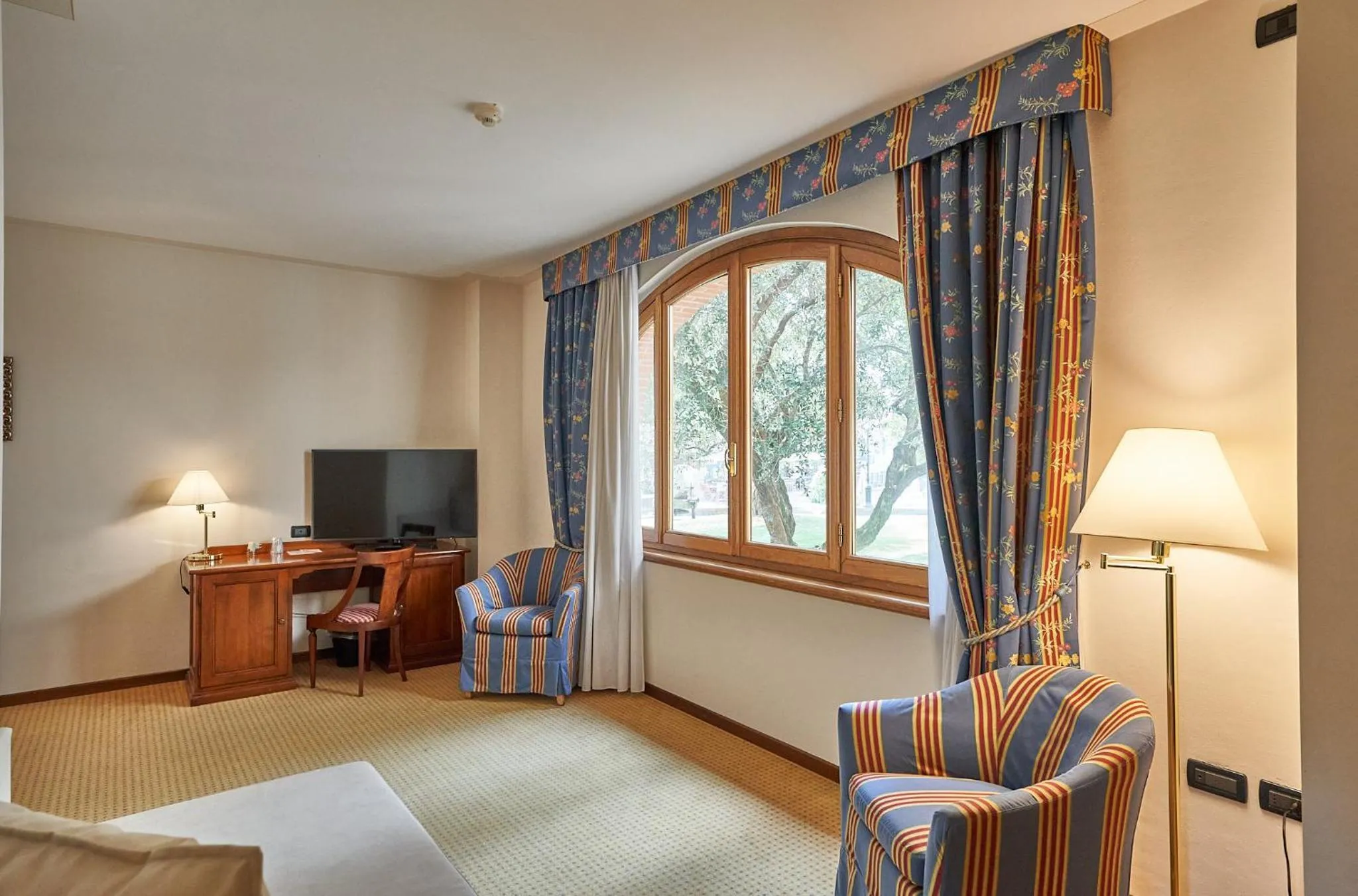 Garden view, Bed in Relais Santo Stefano