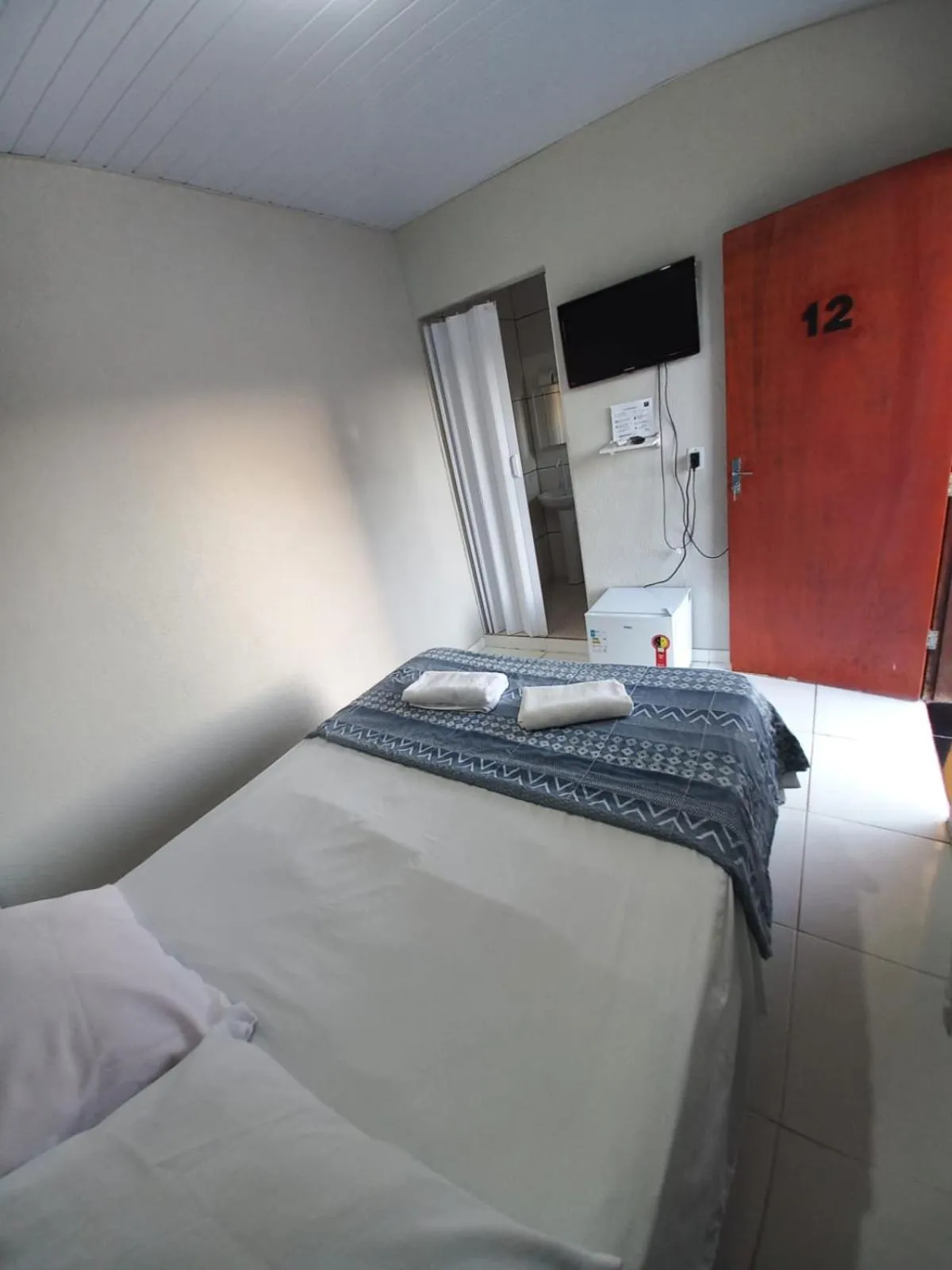 Property building, Bed in Pousada Rio Bonito