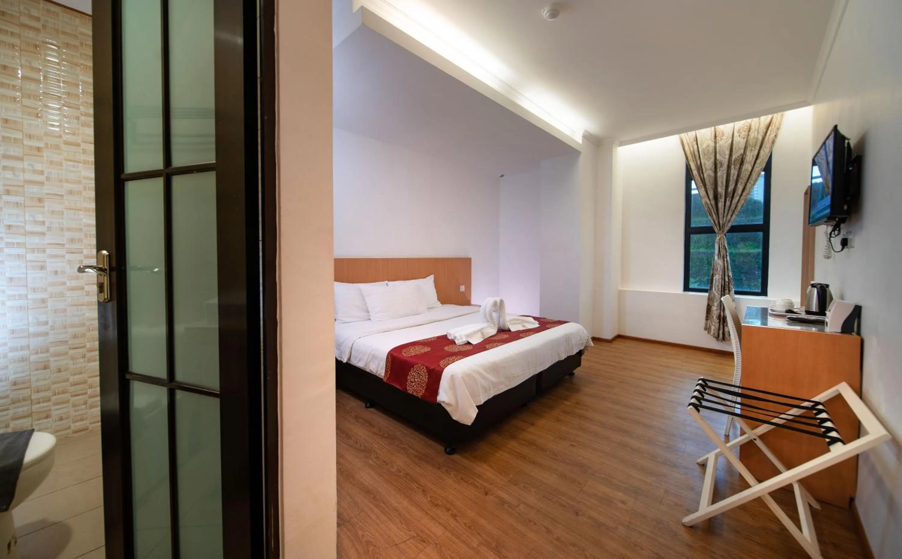 Photo of the whole room, Bed in 1 Million Hotel