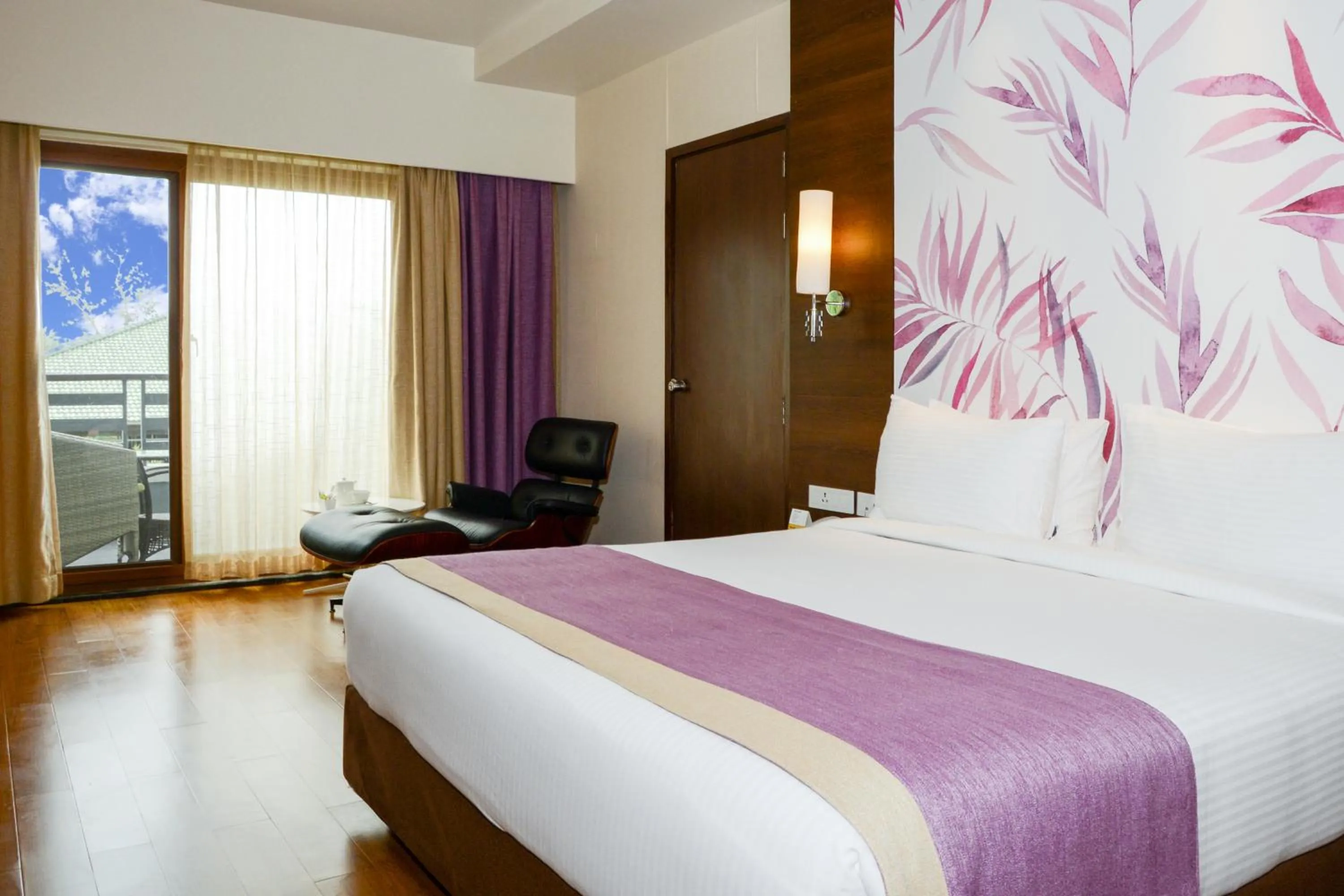 Bed in Purple Palms Resort & Spa