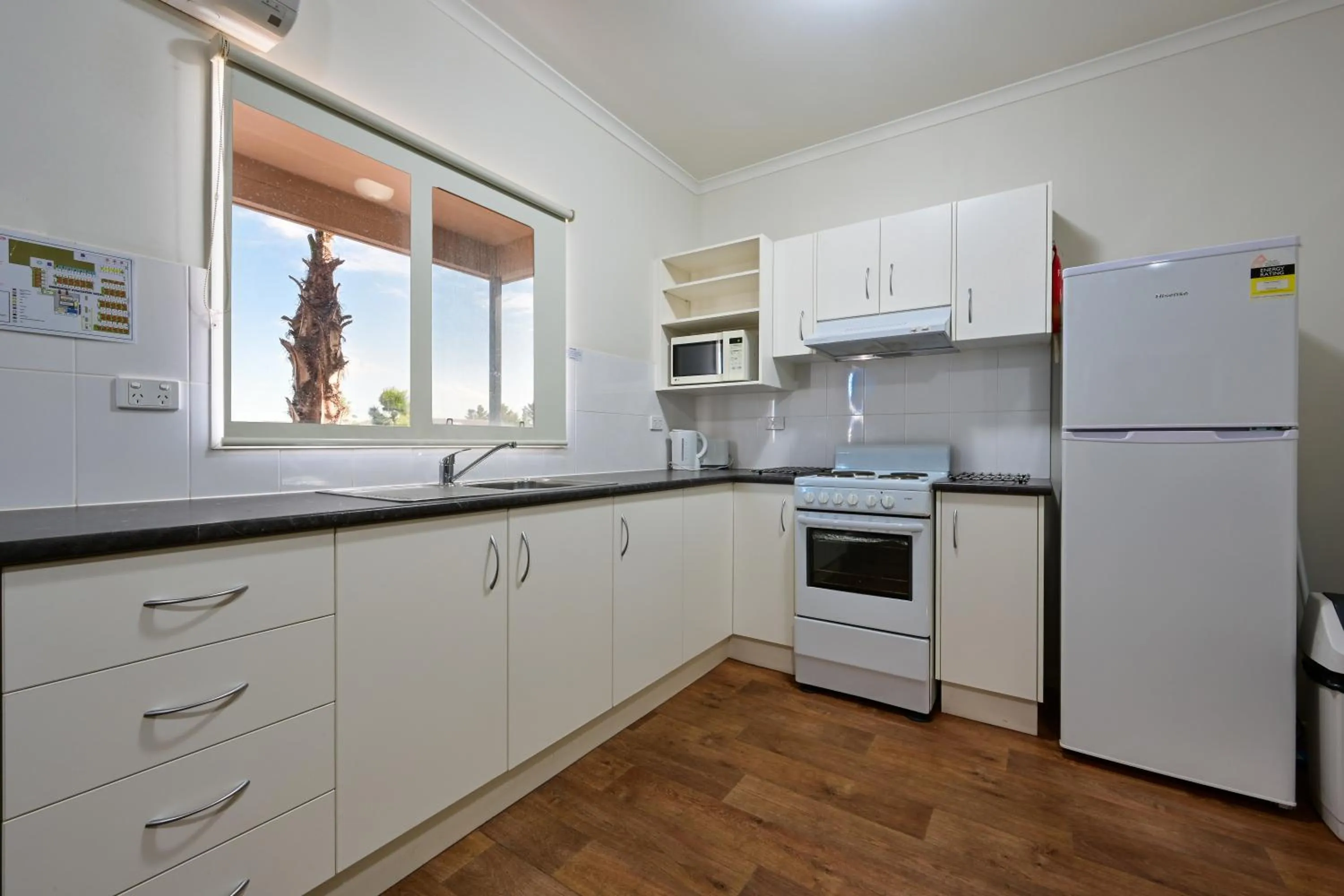 Kitchen or kitchenette in The Sundowner Cabin & Tourist Park