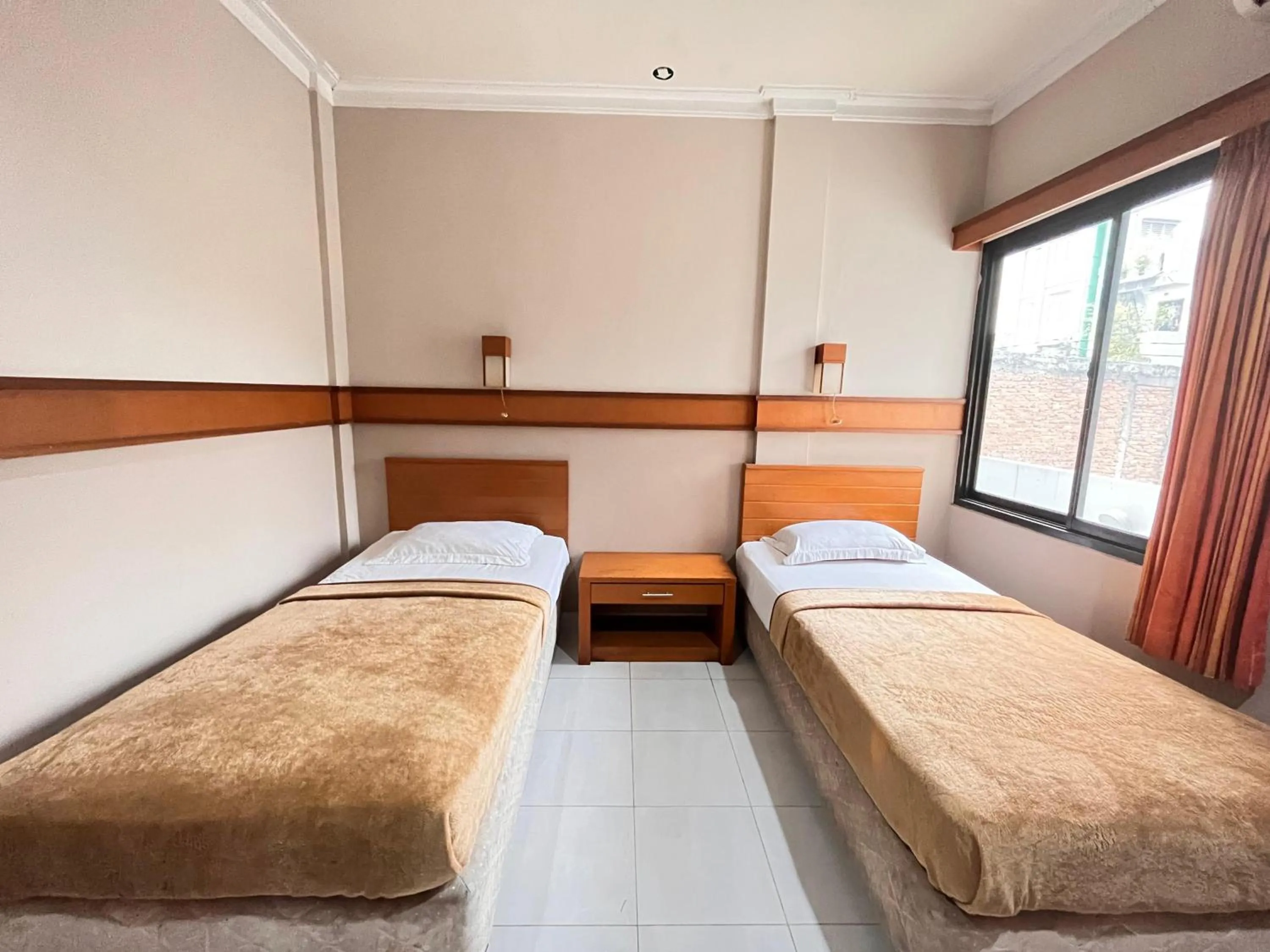 Bed in Hotel Caravan Tanah Abang