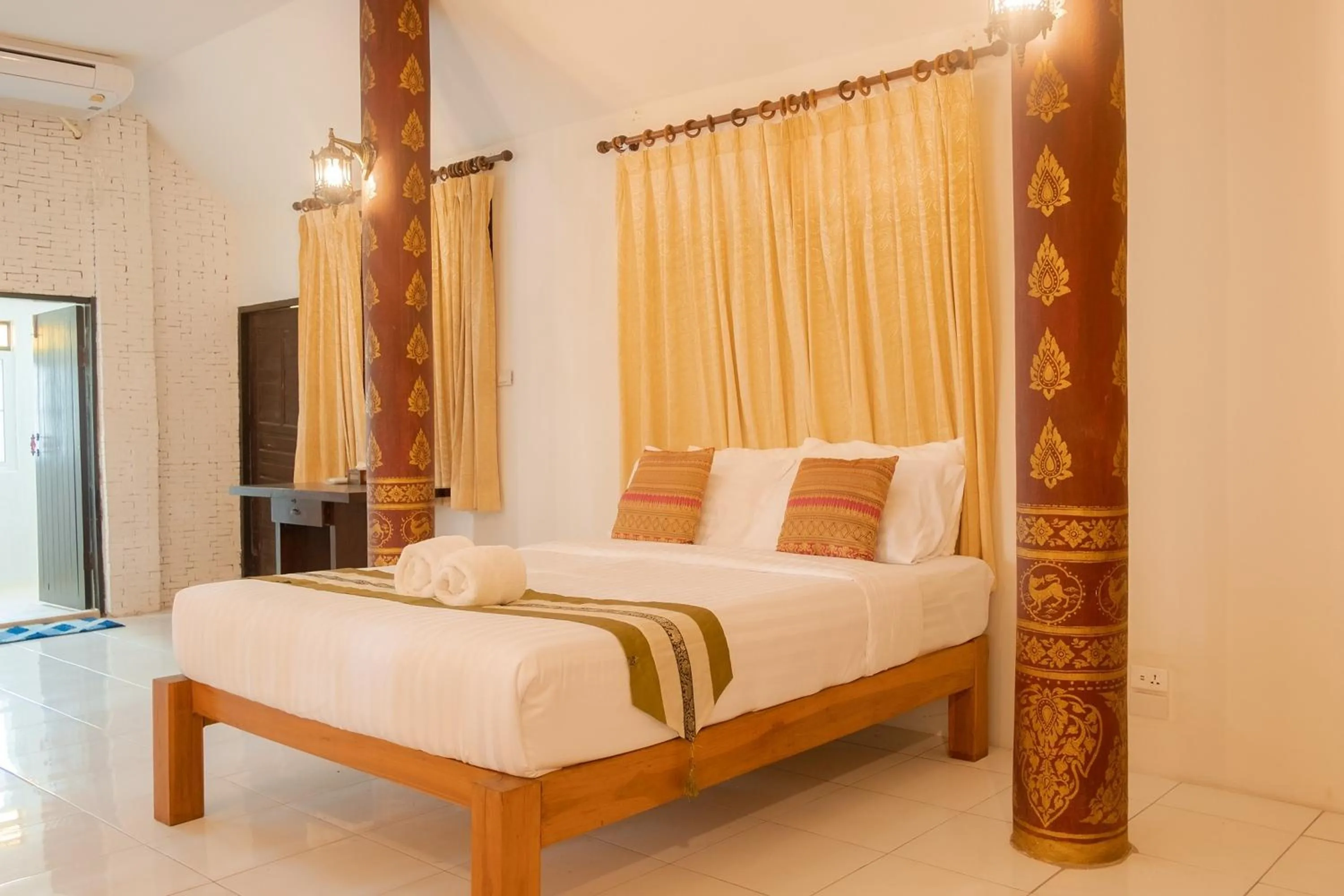Bed in Baan Tawai Lanna Resort