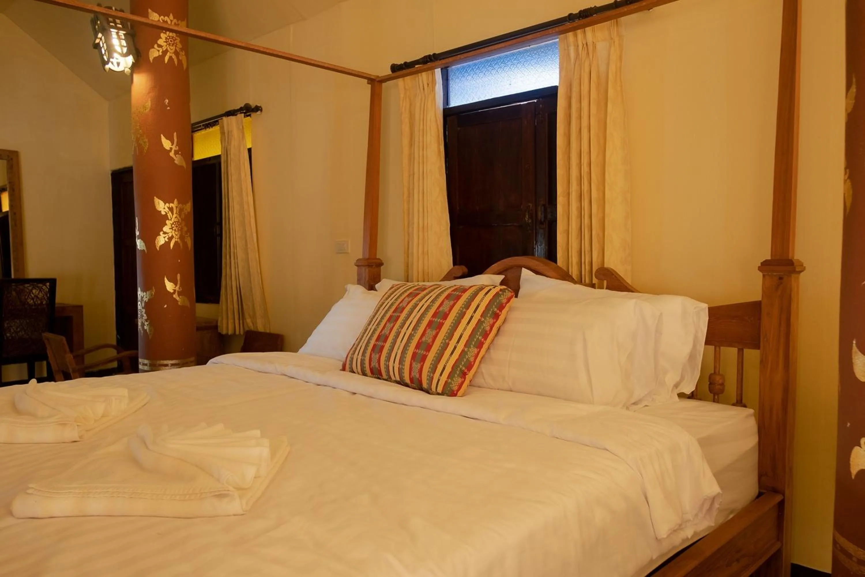 Bed in Baan Tawai Lanna Resort