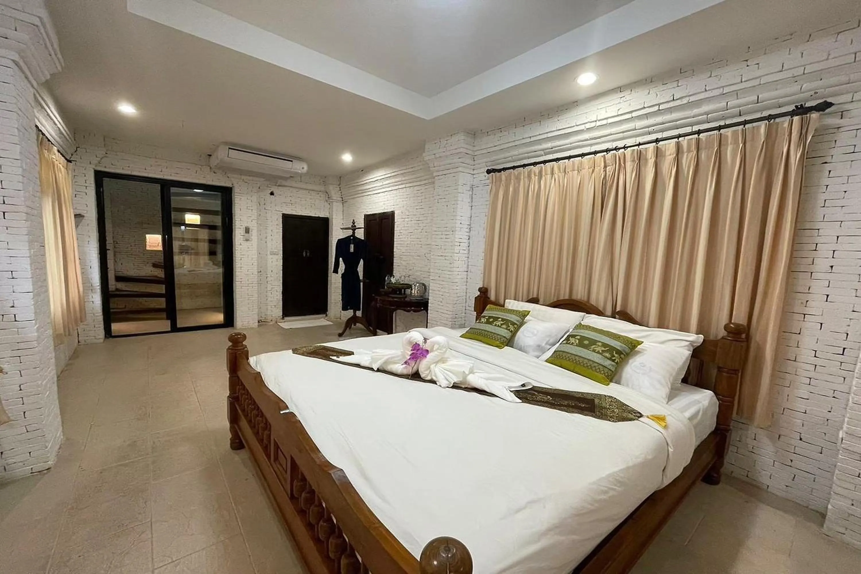 Bed in Baan Tawai Lanna Resort