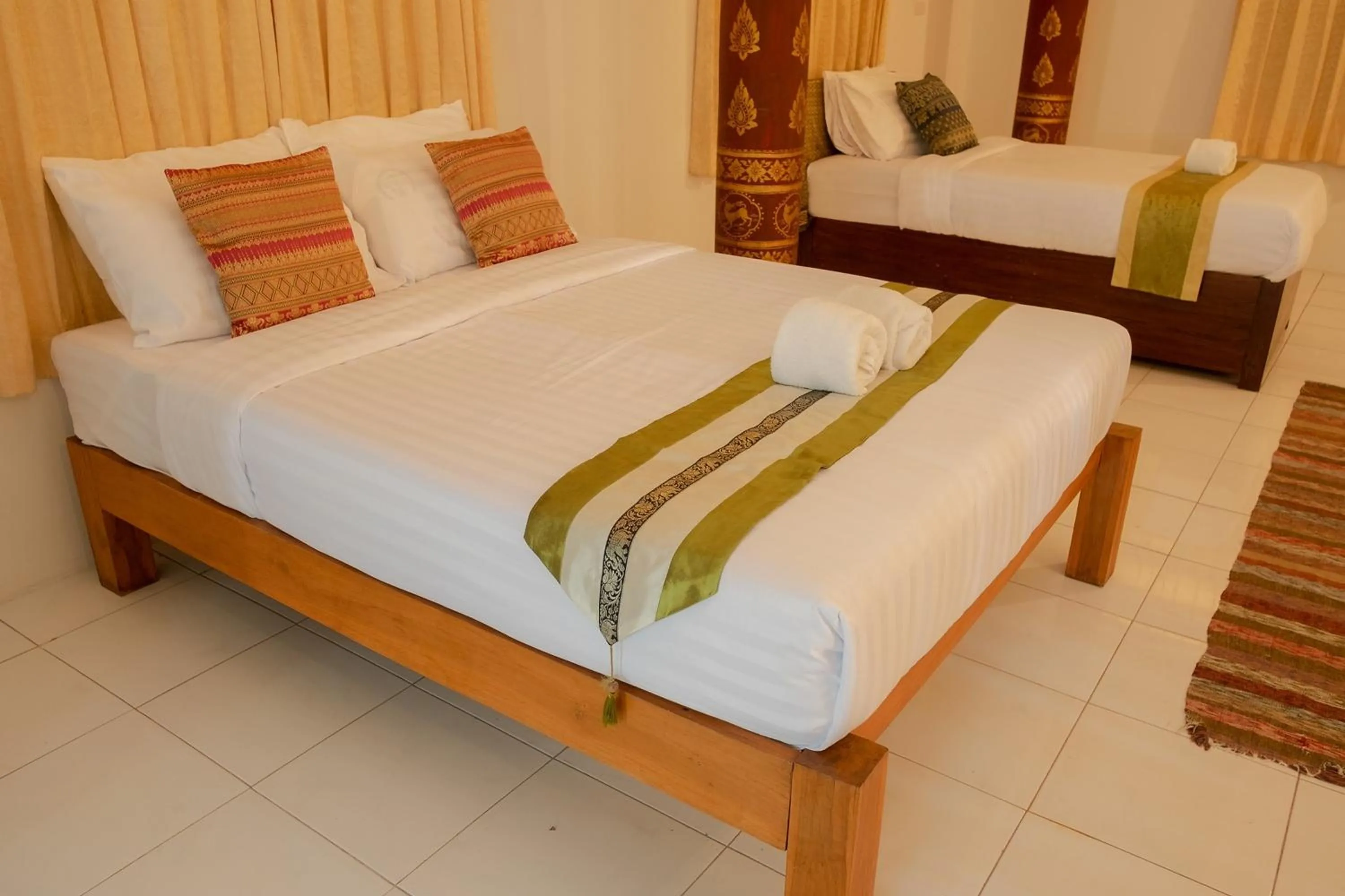 Bed in Baan Tawai Lanna Resort