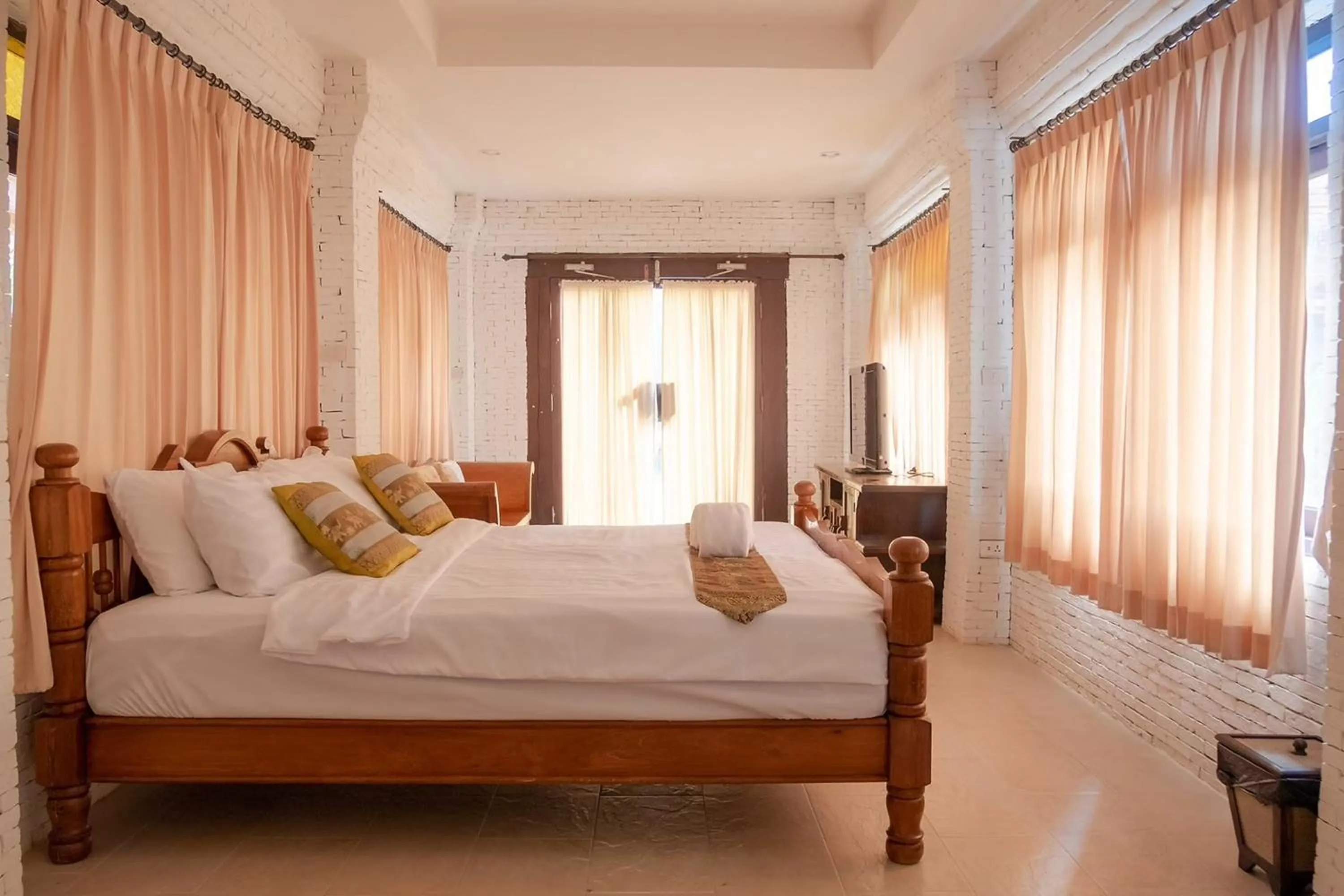 Bed in Baan Tawai Lanna Resort