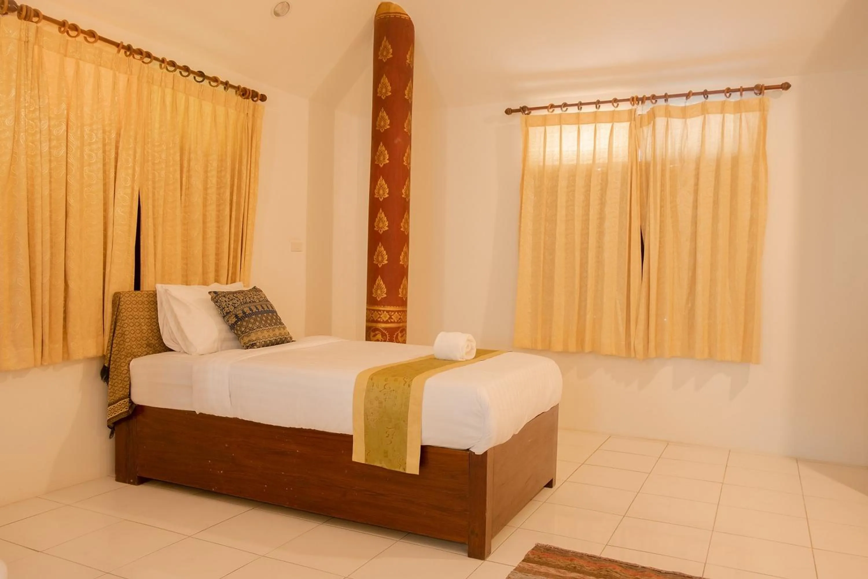 Bed in Baan Tawai Lanna Resort