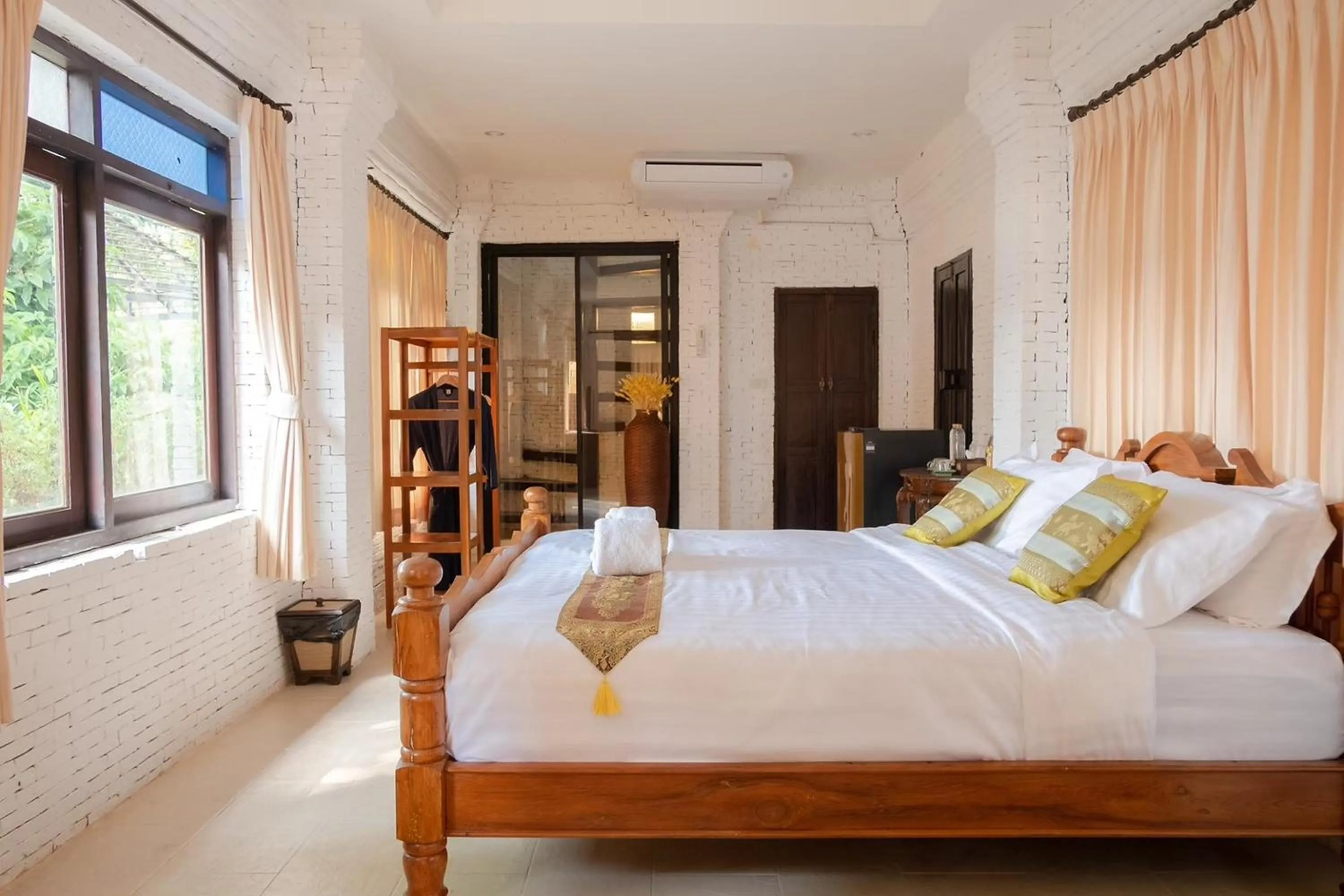 Bed in Baan Tawai Lanna Resort