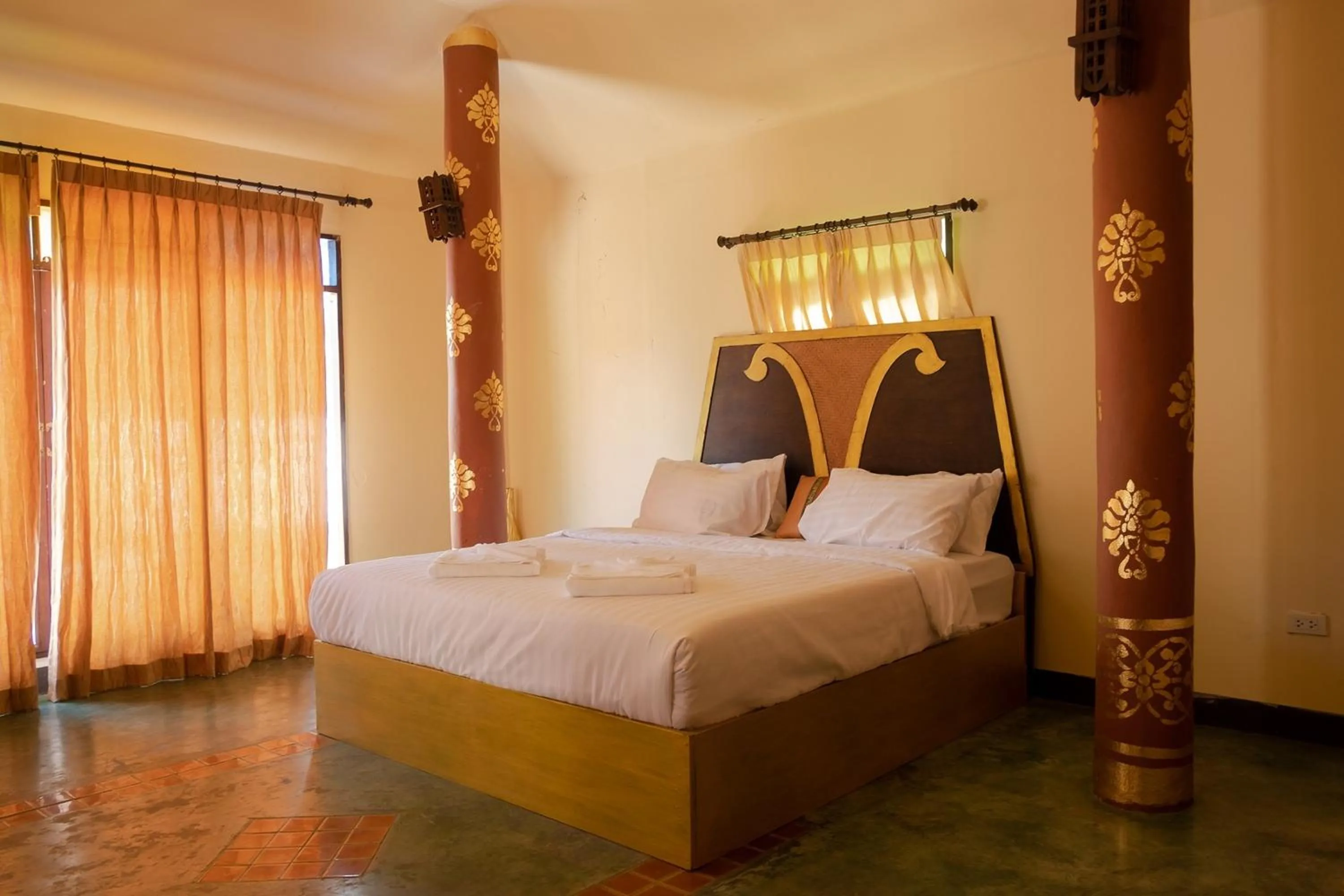 Bed in Baan Tawai Lanna Resort