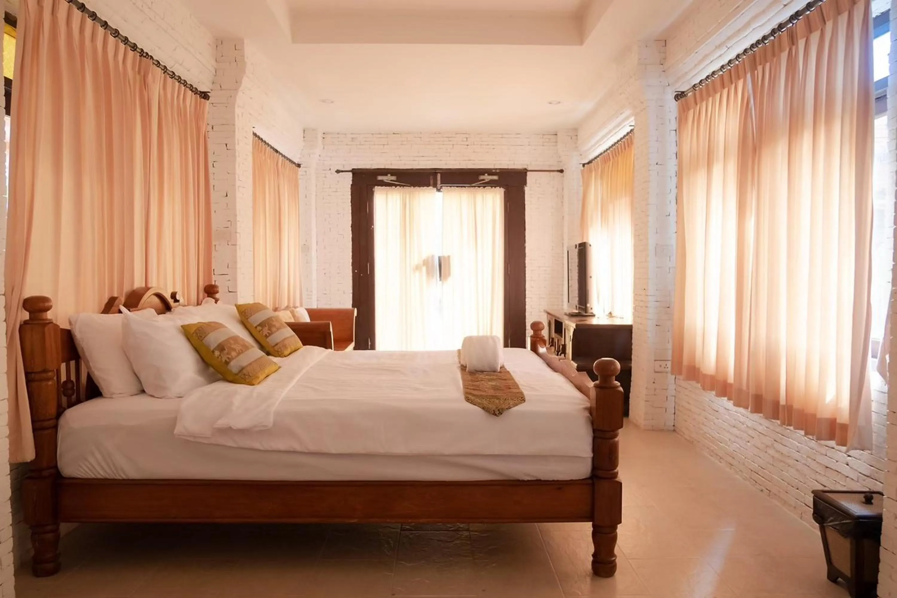 Bed in Baan Tawai Lanna Resort