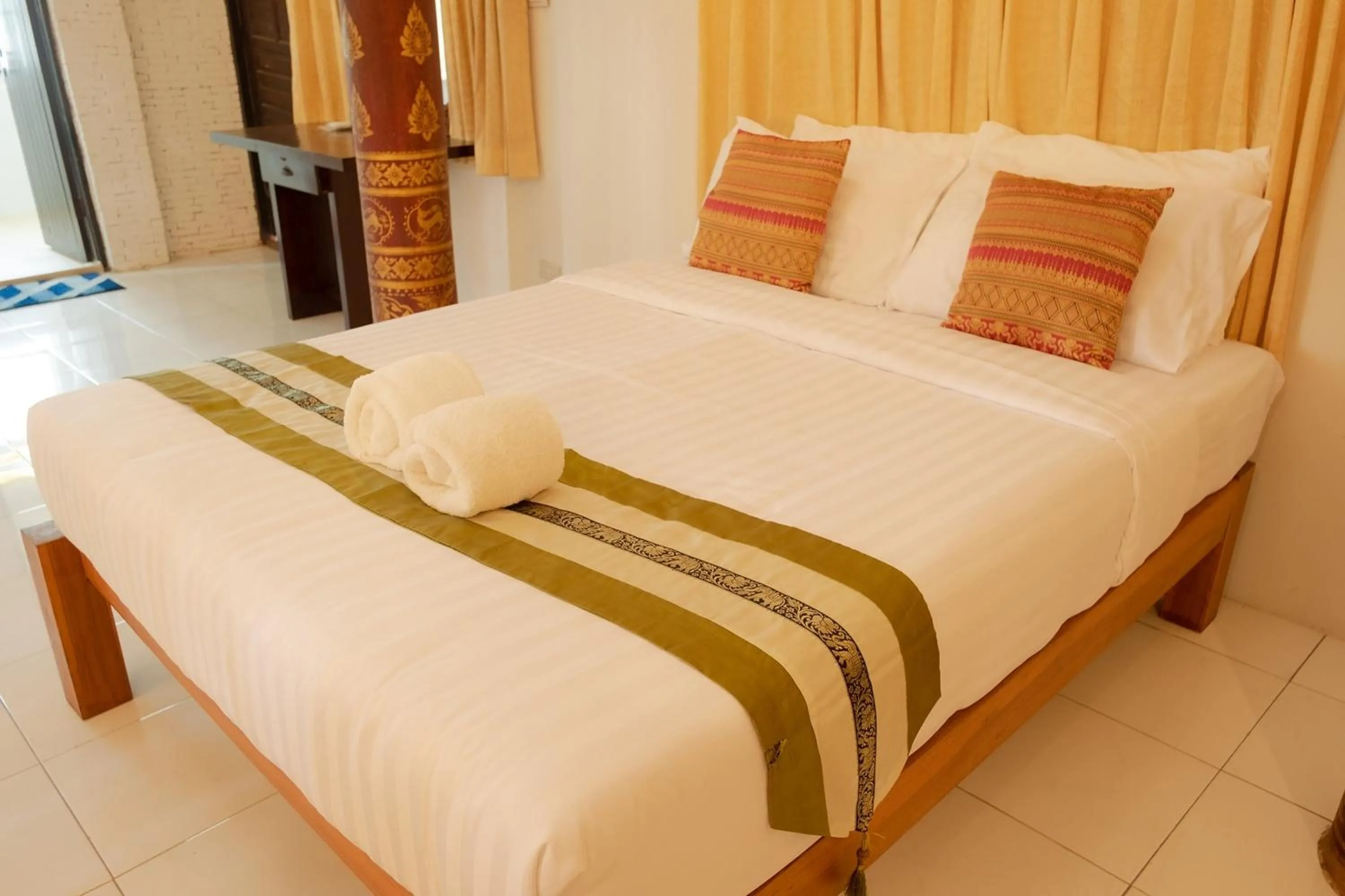 Bed in Baan Tawai Lanna Resort