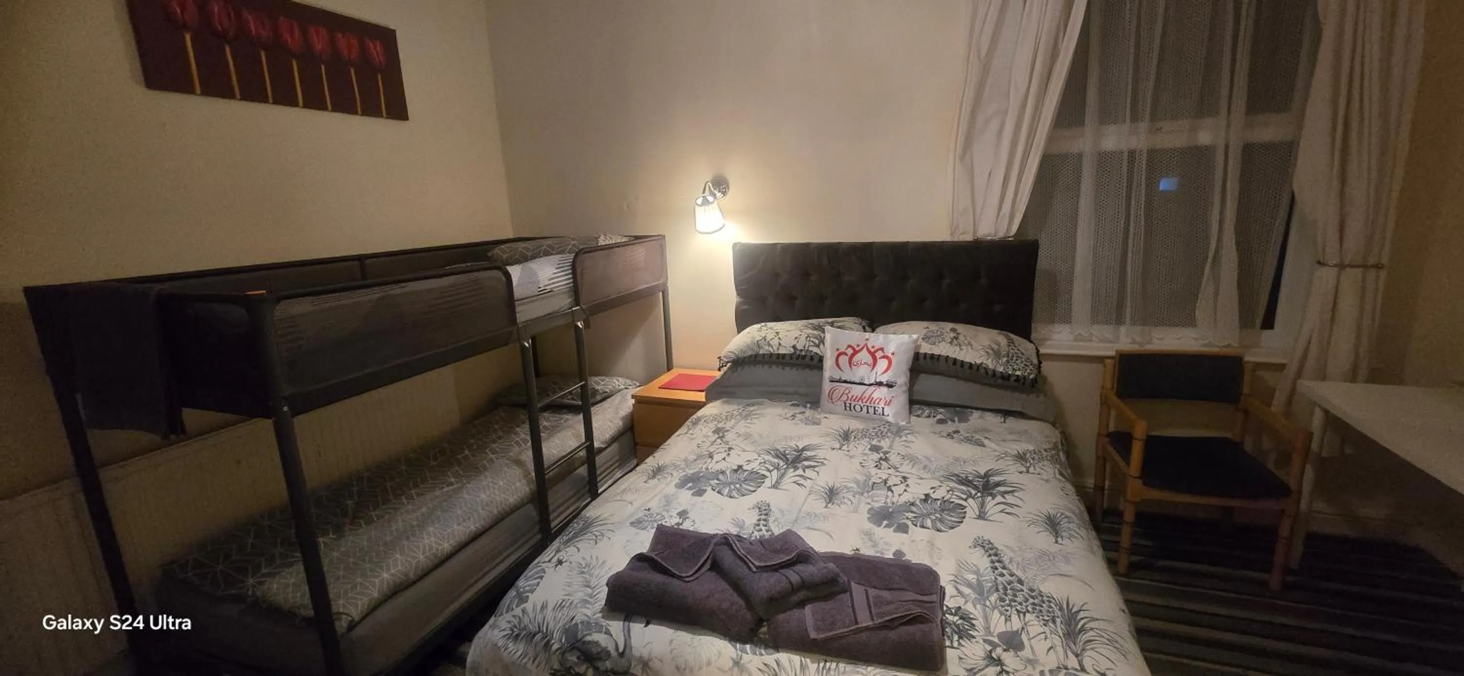 Bed in BUKHARI Hotel