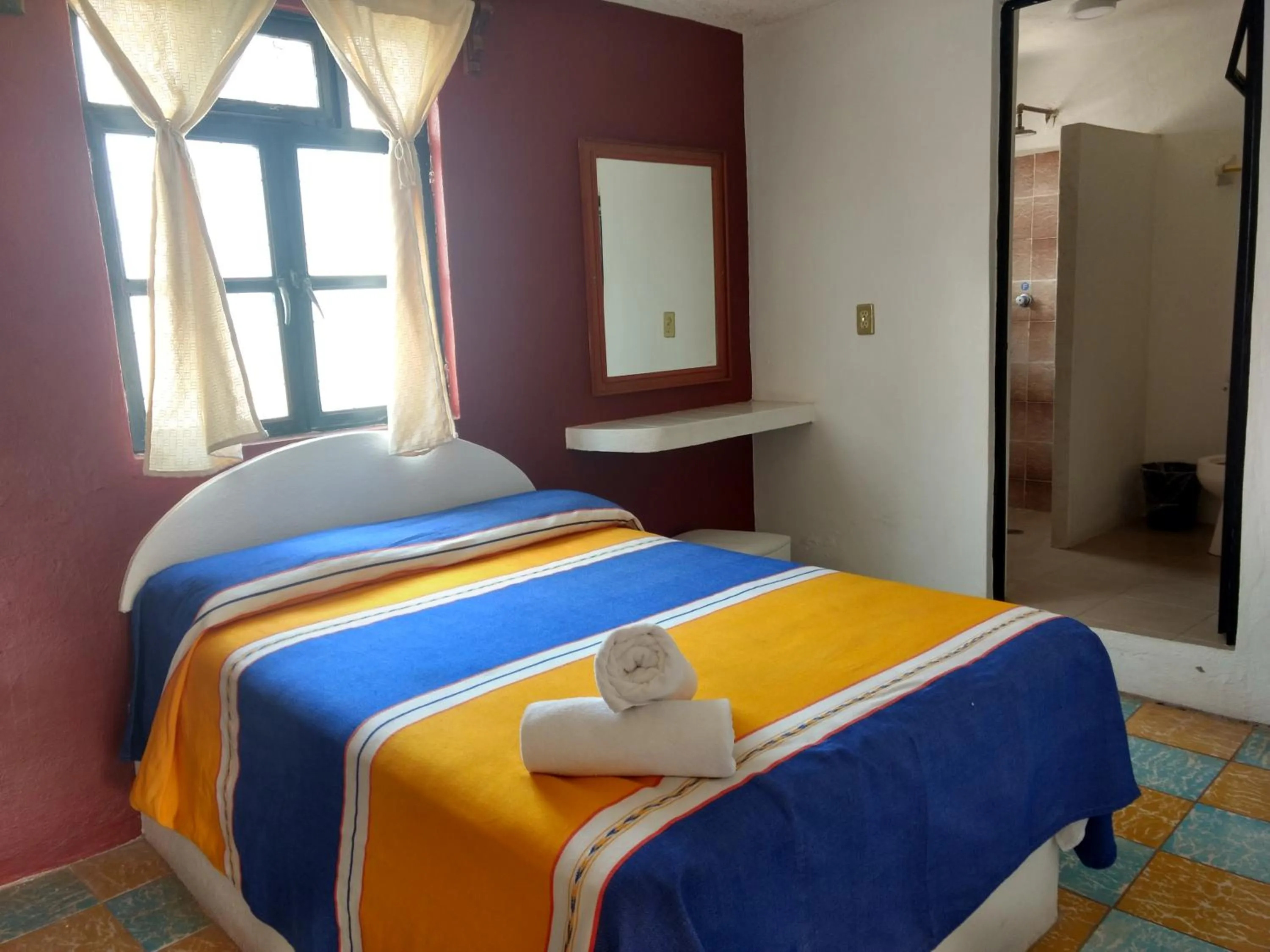 Bed in Hotel Hacienda Morales.