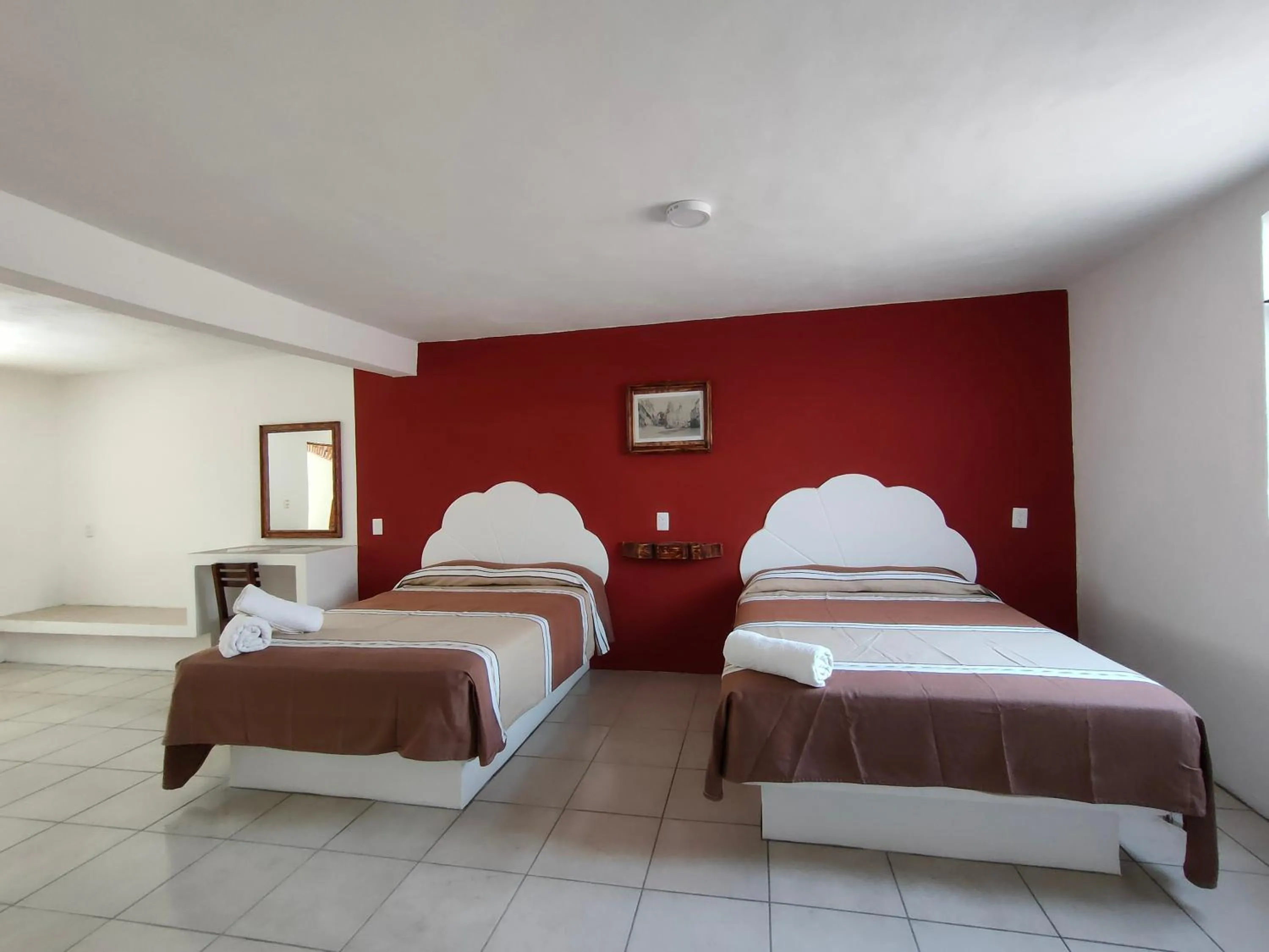 Bed in Hotel Hacienda Morales.