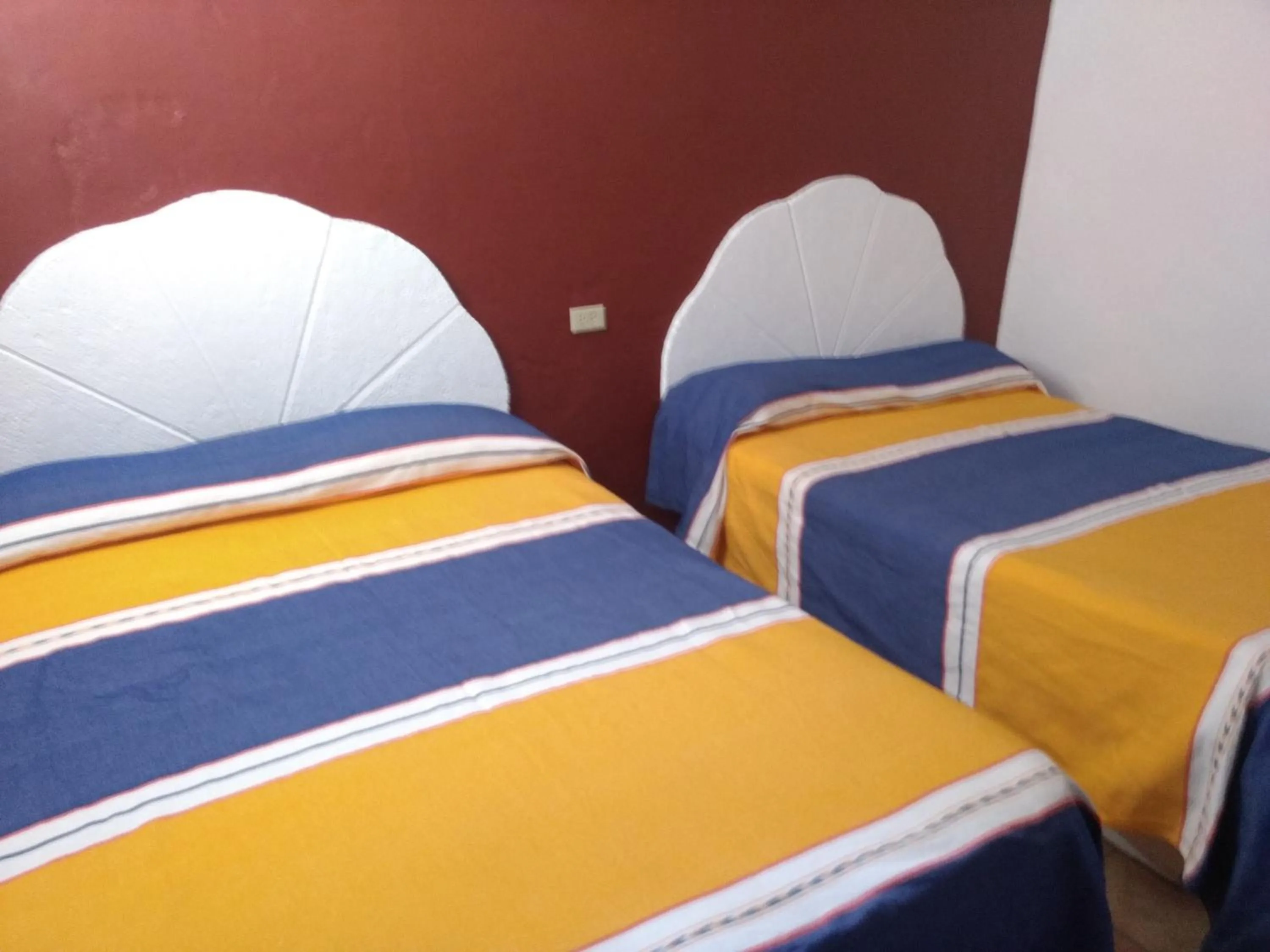 Bed in Hotel Hacienda Morales.