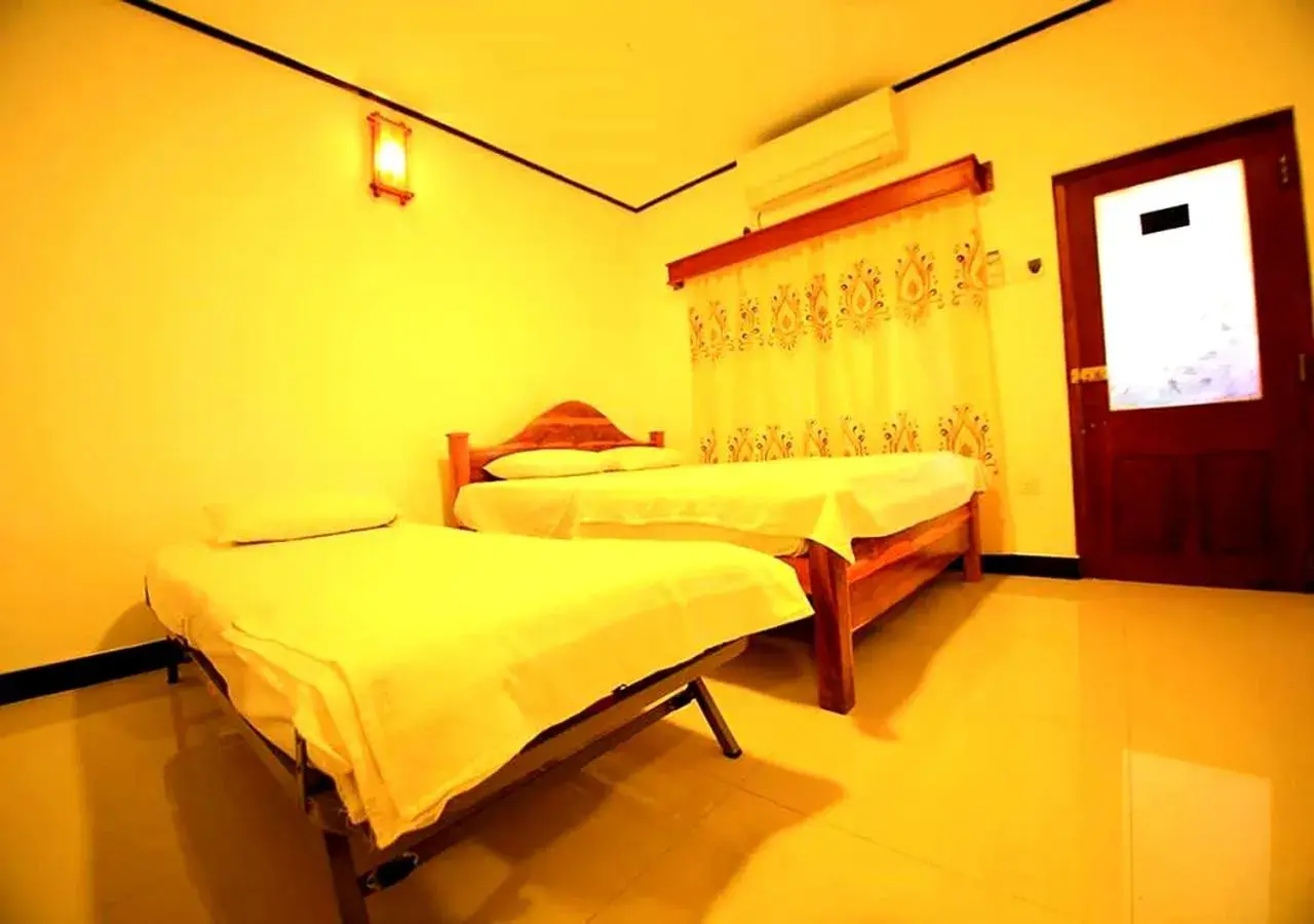 Triple Room with Private Bathroom in Yuthika Resort Triple Room with Private Bathroom in Yuthika Resort