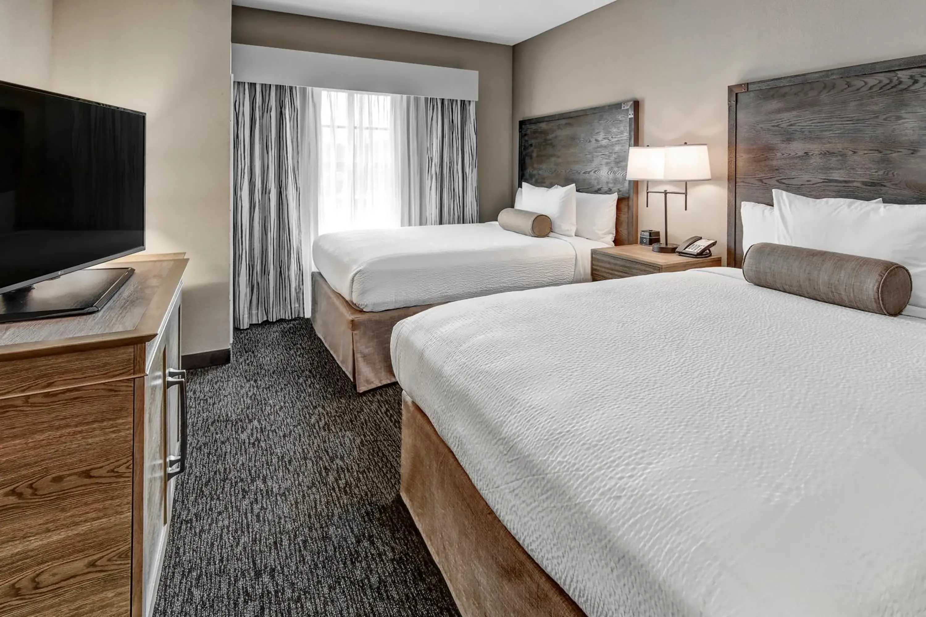 Junior Suite with Two Queen Beds in Black Fox Lodge Pigeon Forge, Tapestry Collection by Hilton Junior Suite with Two Queen Beds in Black Fox Lodge Pigeon Forge, Tapestry Collection by Hilton