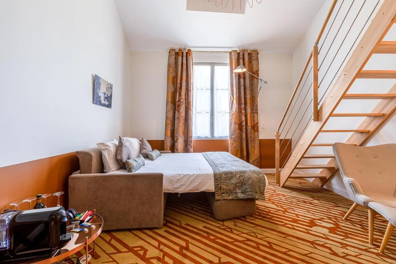 Bed in Hotel Le Saint Gelais