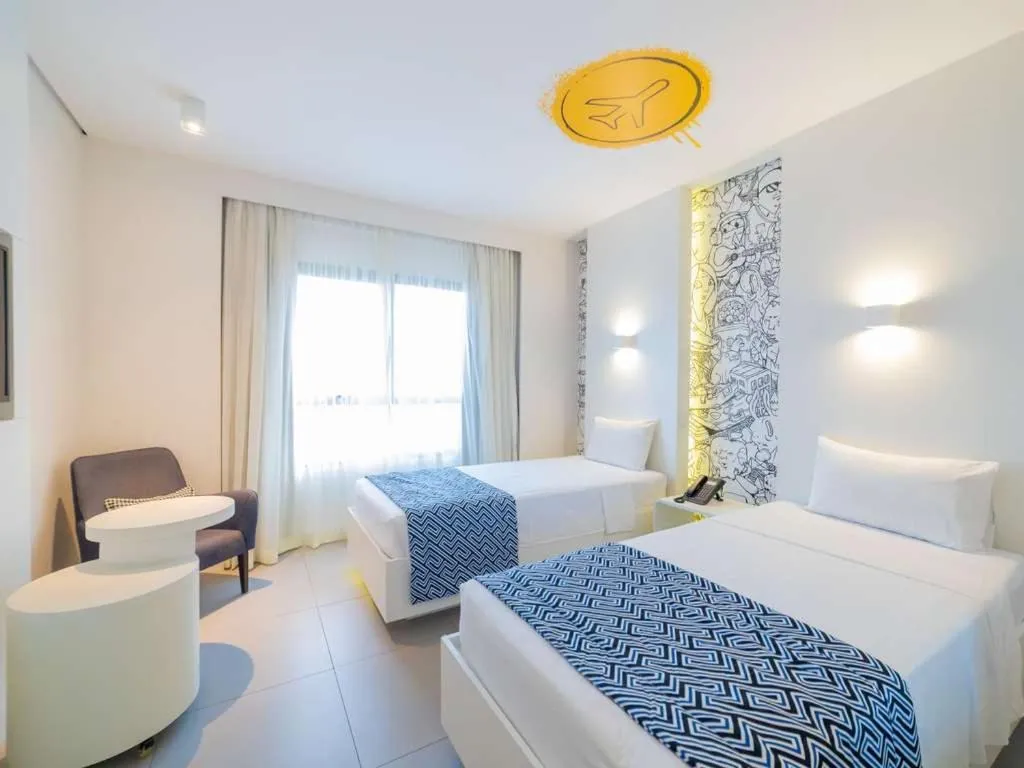 Bed in Golden Tower Maracanaú by Fênix Hotéis