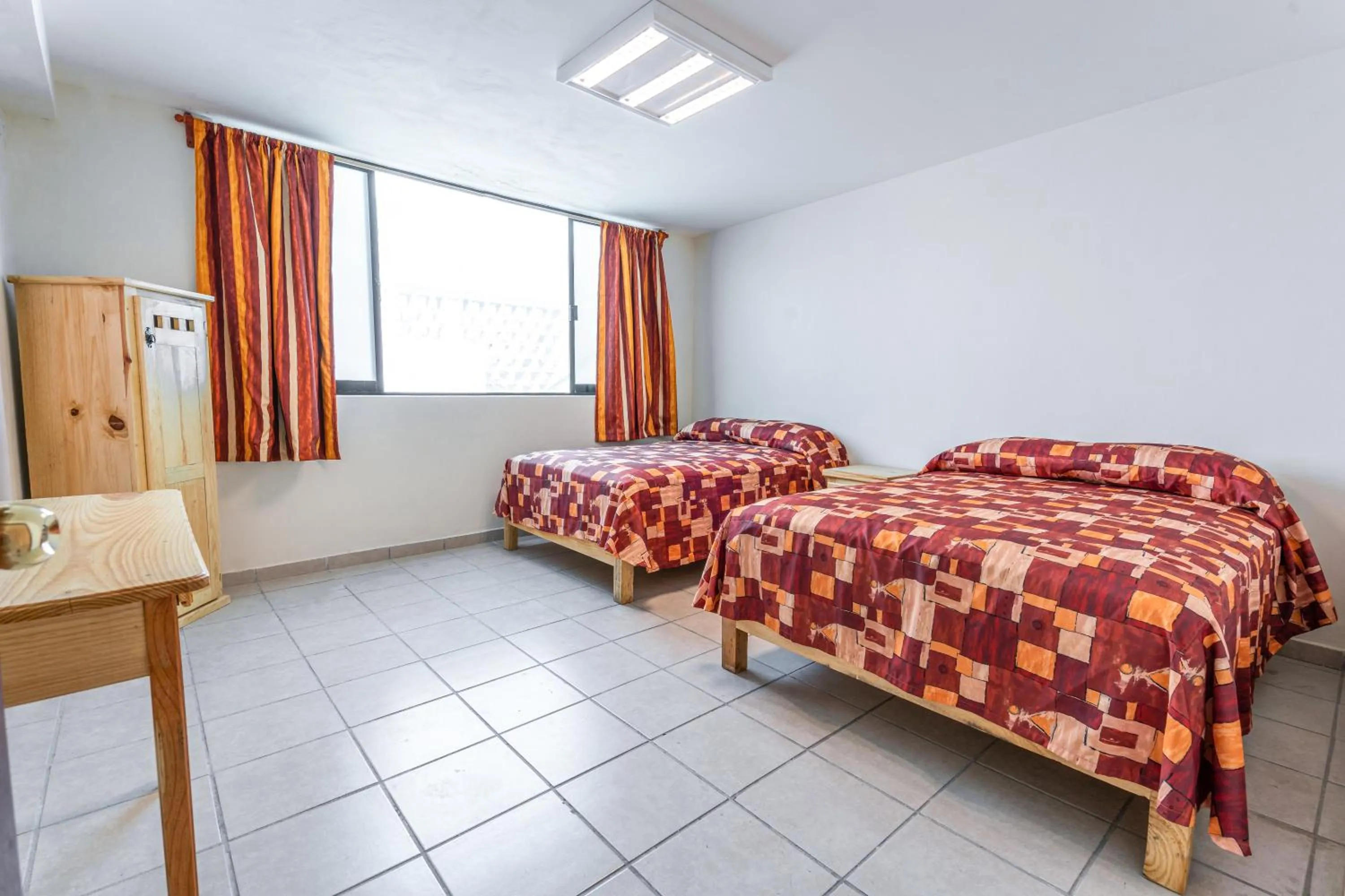 Bed in Cinco de Mayo Hotel