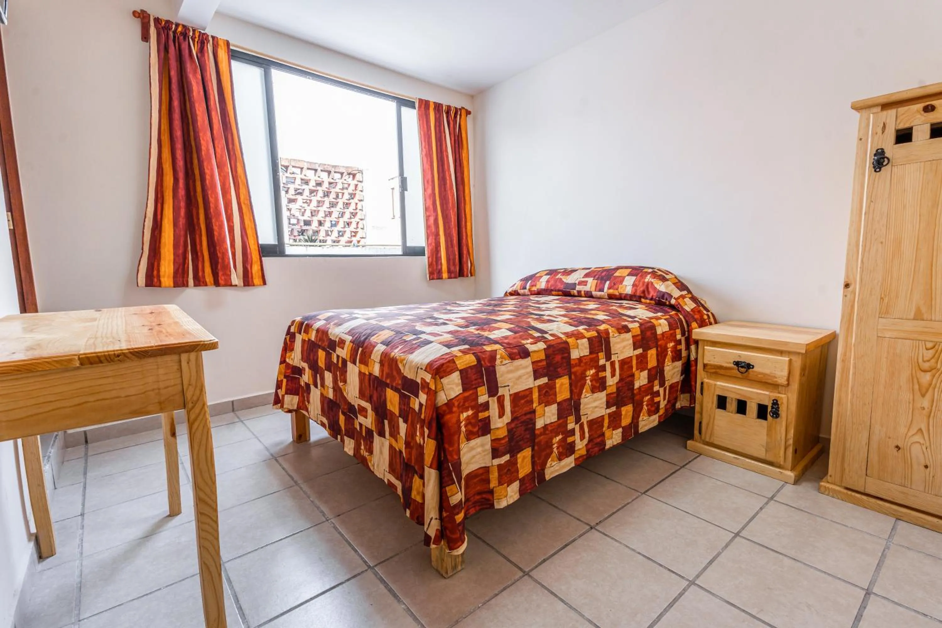 Bed in Cinco de Mayo Hotel