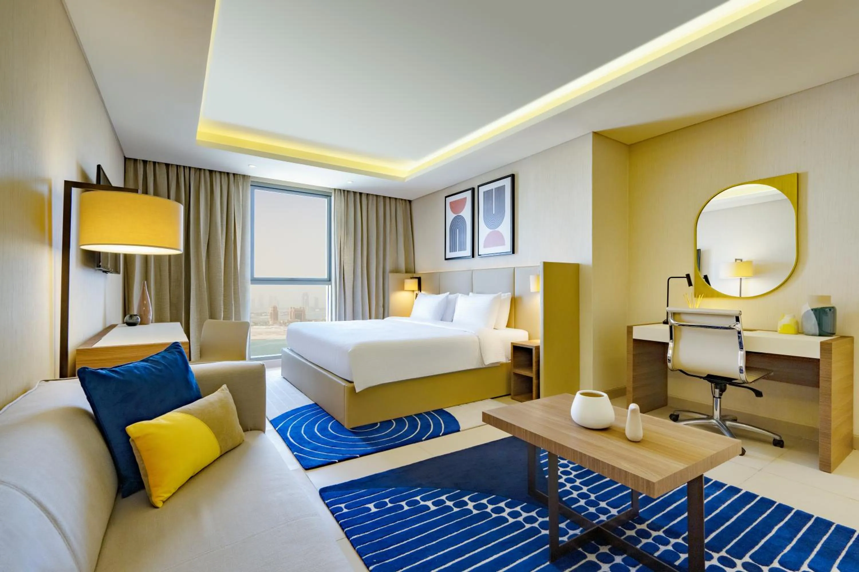Living room, Bed in voco Doha West Bay Suites by IHG